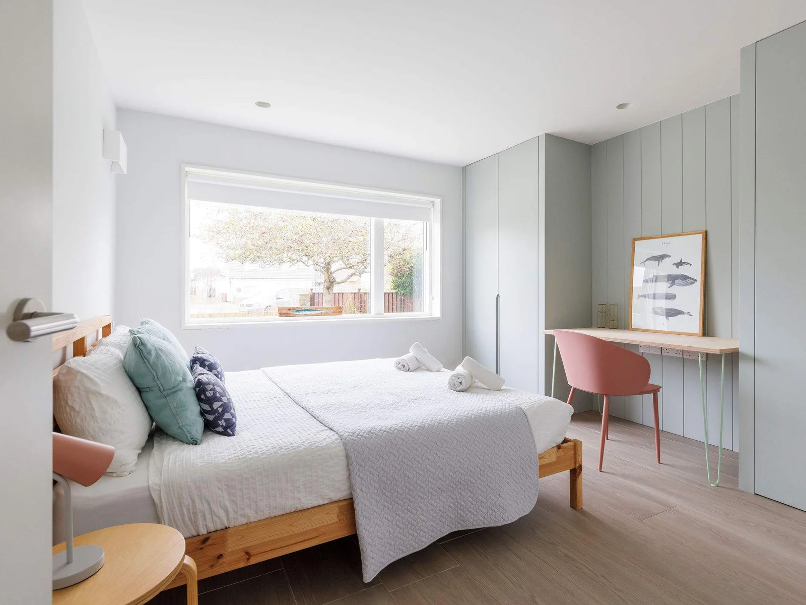 Our downstairs king bed with beautiful pastel colours