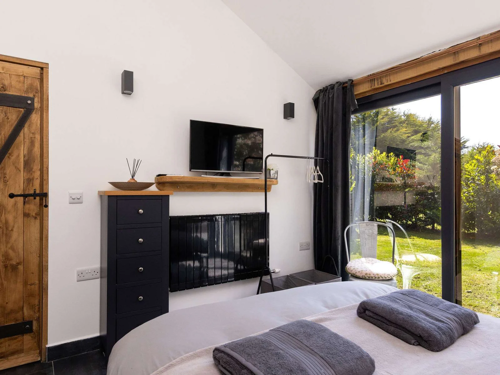 Enjoy bright mornings with floor-to-ceiling garden doors opening directly onto the spacious private courtyard.