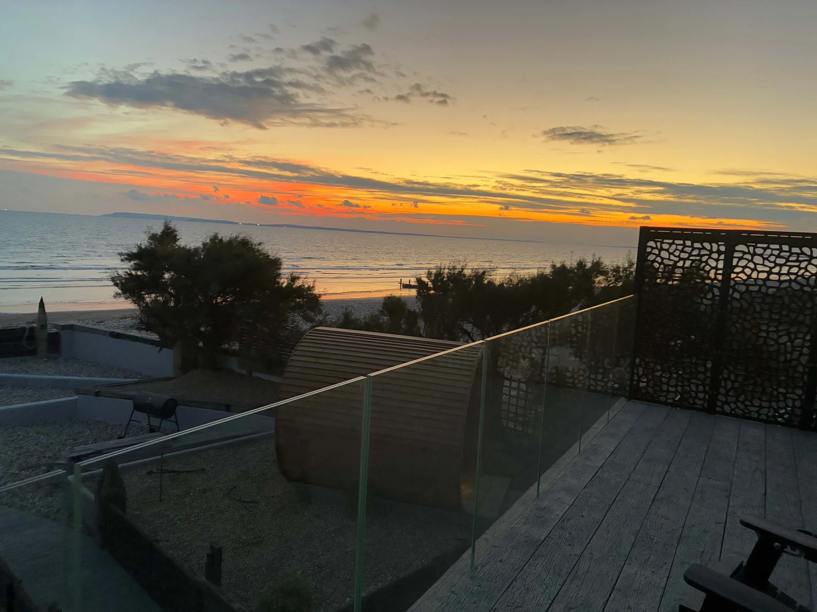 Newly built first-floor balcony with glass balustrade offering panoramic views of the coastline.