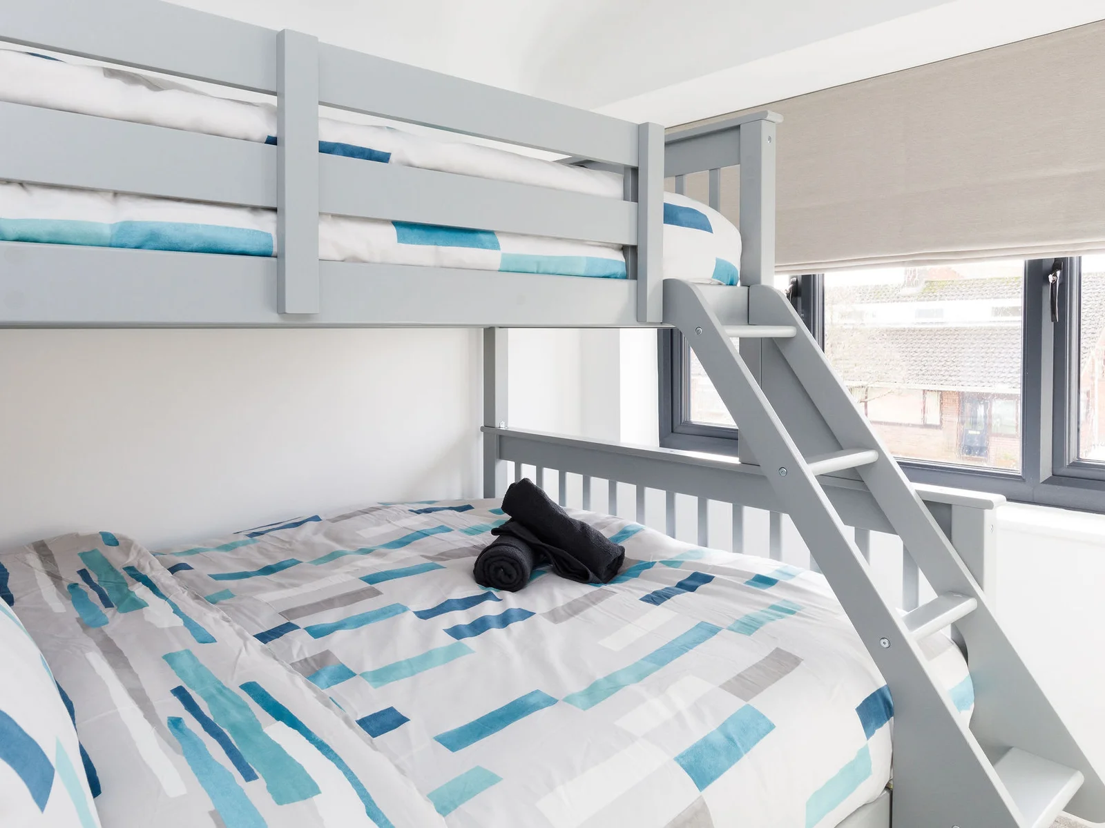 A single bunk is at the top (recommended for children), with a double on the bottom.