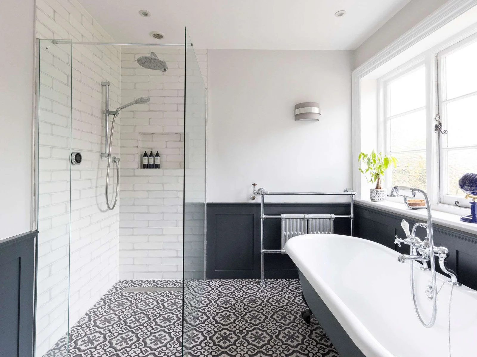 A sleek bathroom with a freestanding tub and walk-in shower