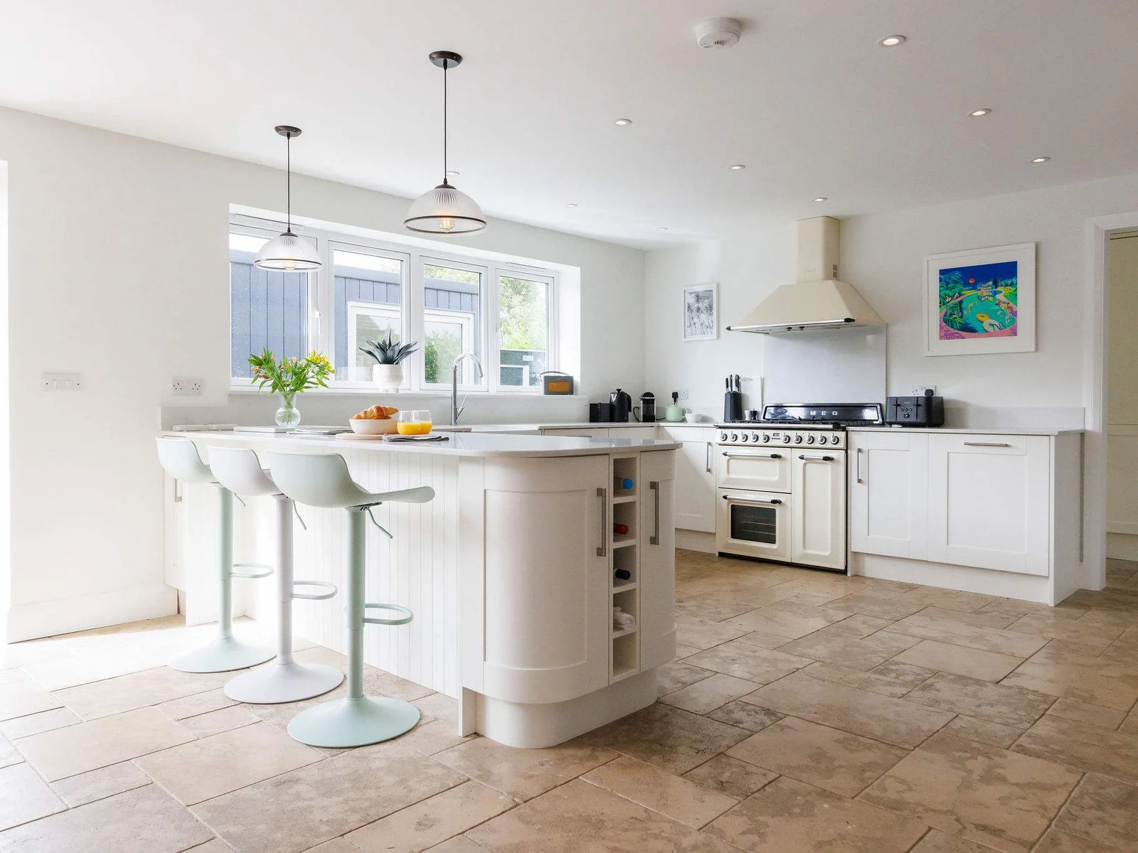 The open plan kitchen and dining, with breakfast bar, creates a fantastic space for families and friends to cook and socialise together.
