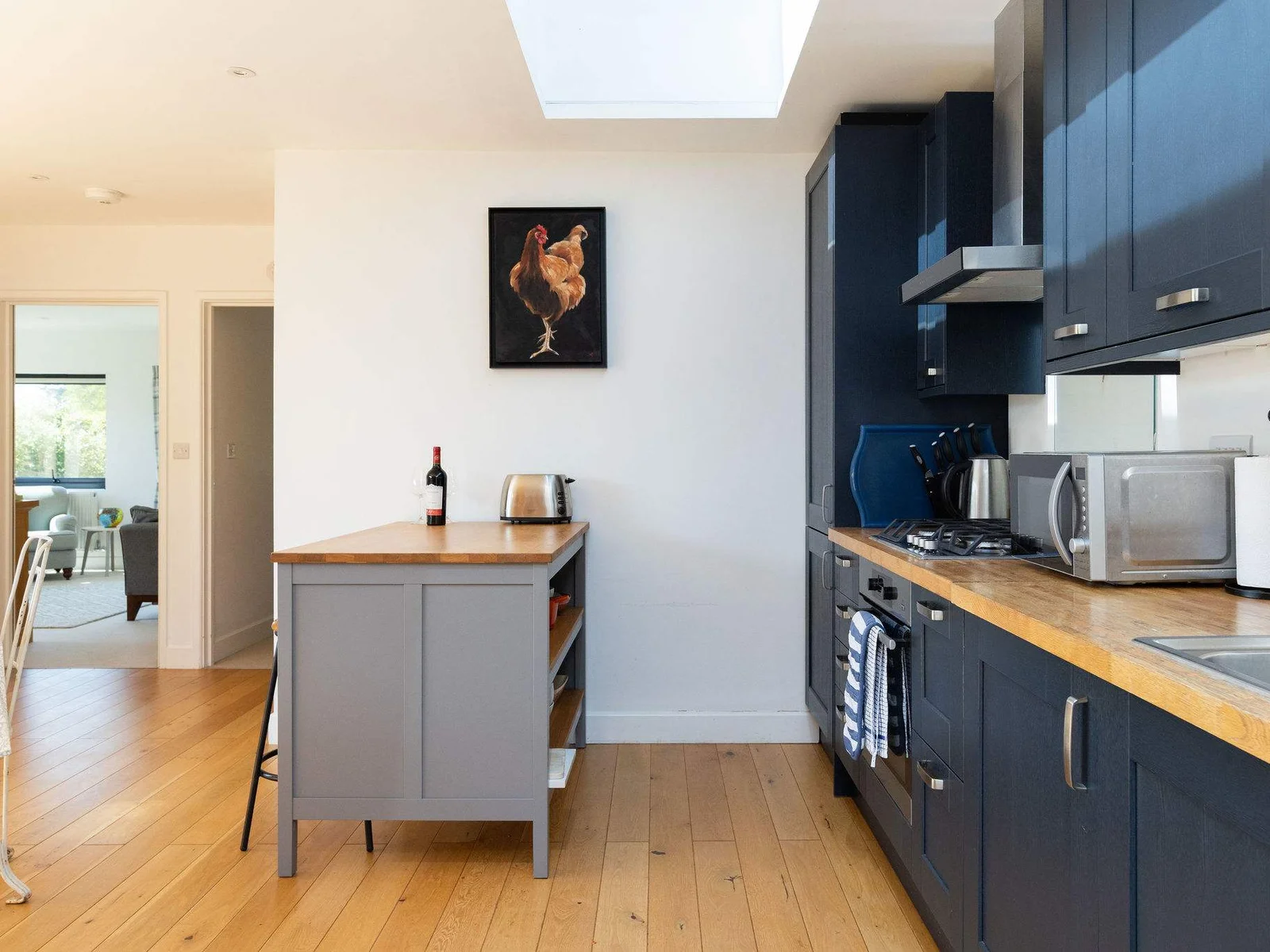 The kitchen island is the perfect spot for a drink or morning coffee.