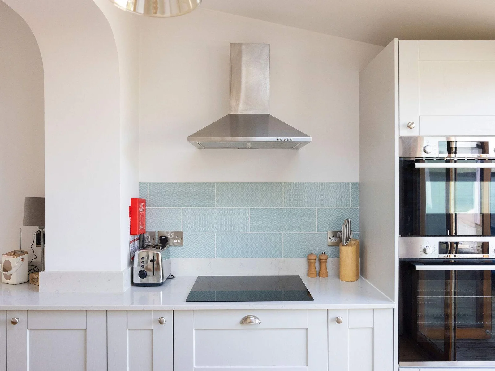 Our fully equipped kitchen features modern amenities including a double oven and dishwasher.