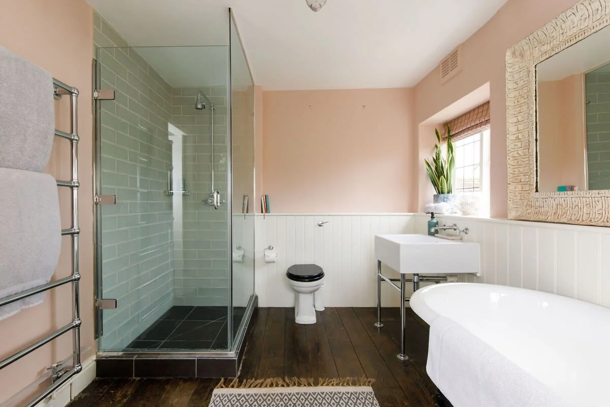 The master ensuite has a luxury roll top bath and spacious walk-in shower.