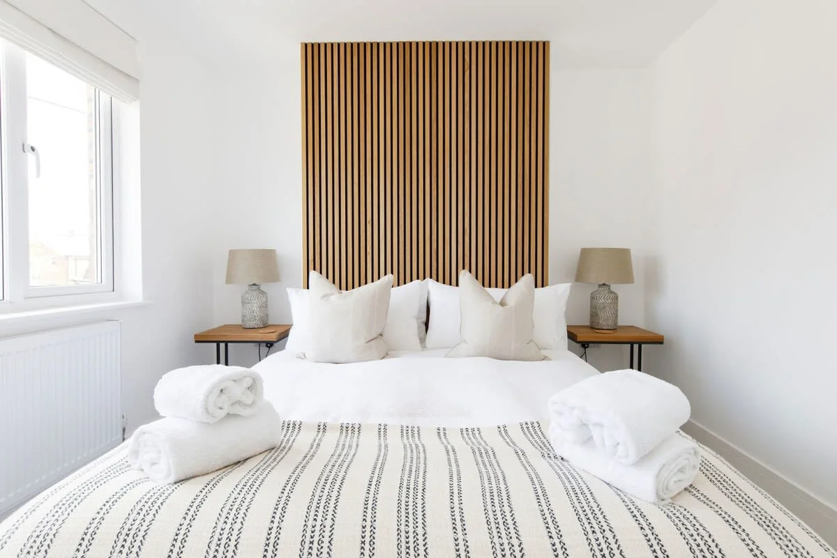 The king bedroom has quality bedding, linen and sheets, as well as side tables with reading lamps.