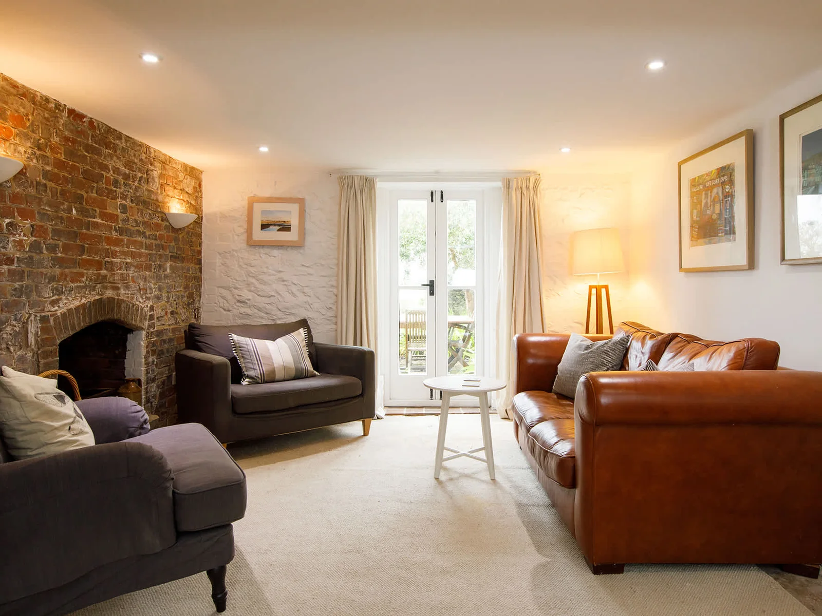 Plenty of space for all to sit in the lounge. Swing the doors open for the sea breeze!