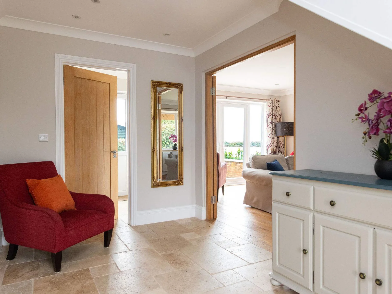 Step inside to a bright and welcoming hallway, with natural stone flooring, warm oak doors and homely touches that set the tone for the rest of Seaview.