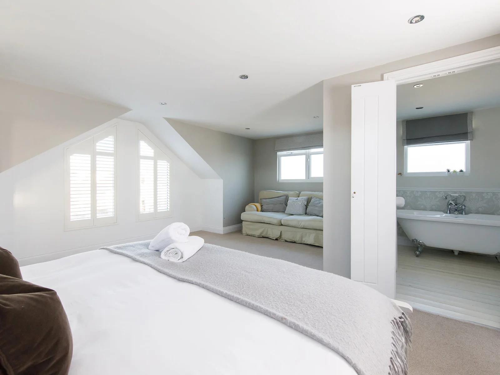 The beautiful master bedroom has a comfy king bed, side tables and reading lights for ultimate comfort.