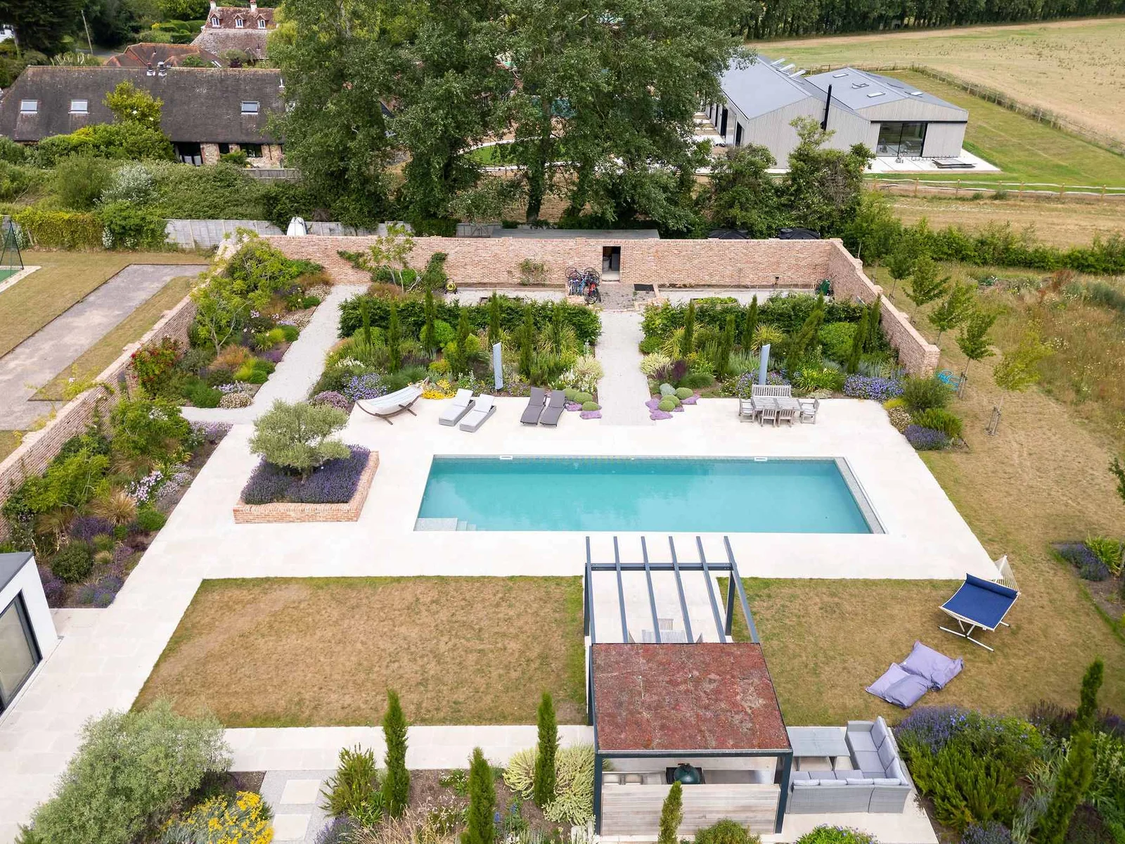 Landscaped gardens surrounding the heated outdoor pool
