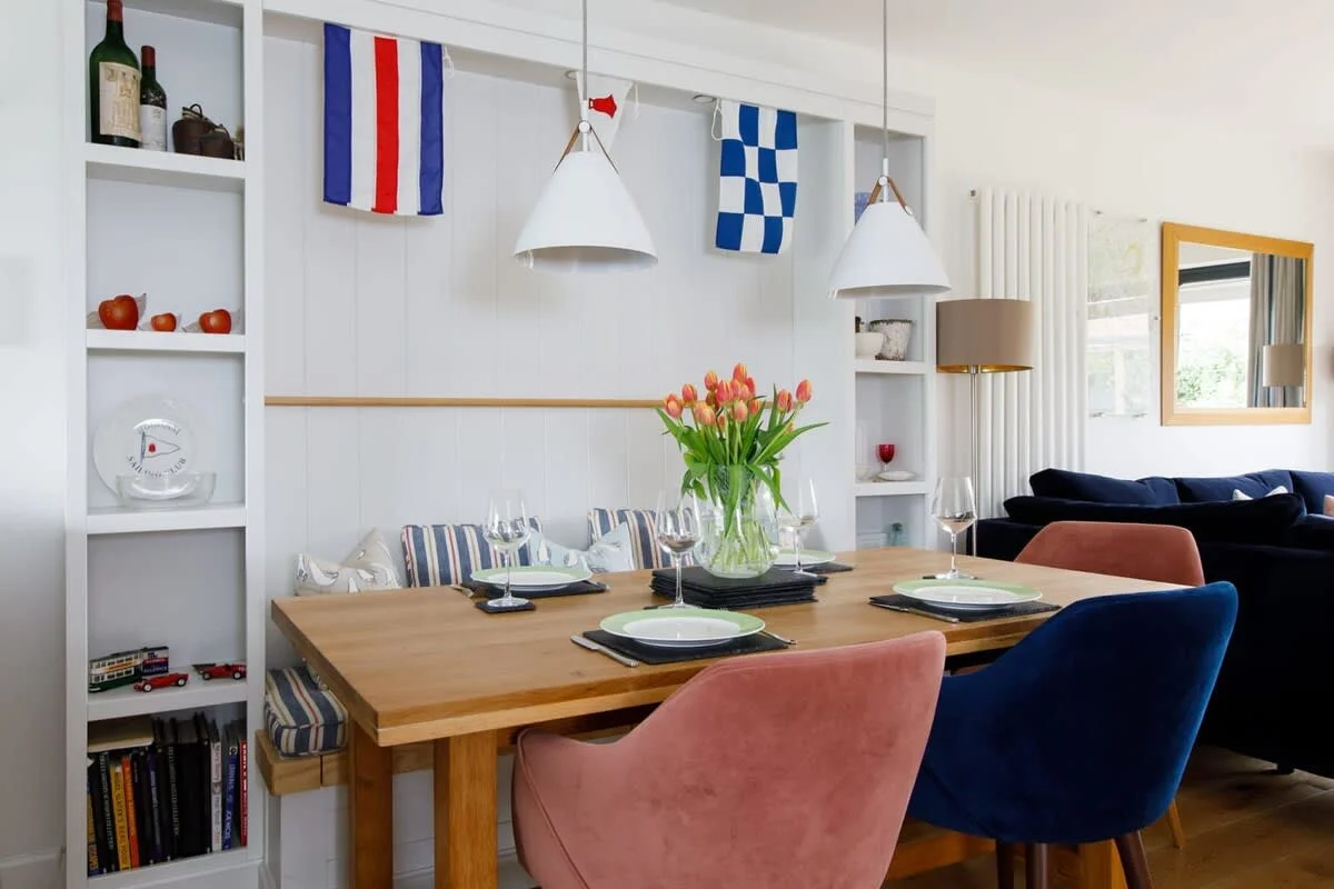 The dining table comfortably seats 6 people with a bench seat on one side.