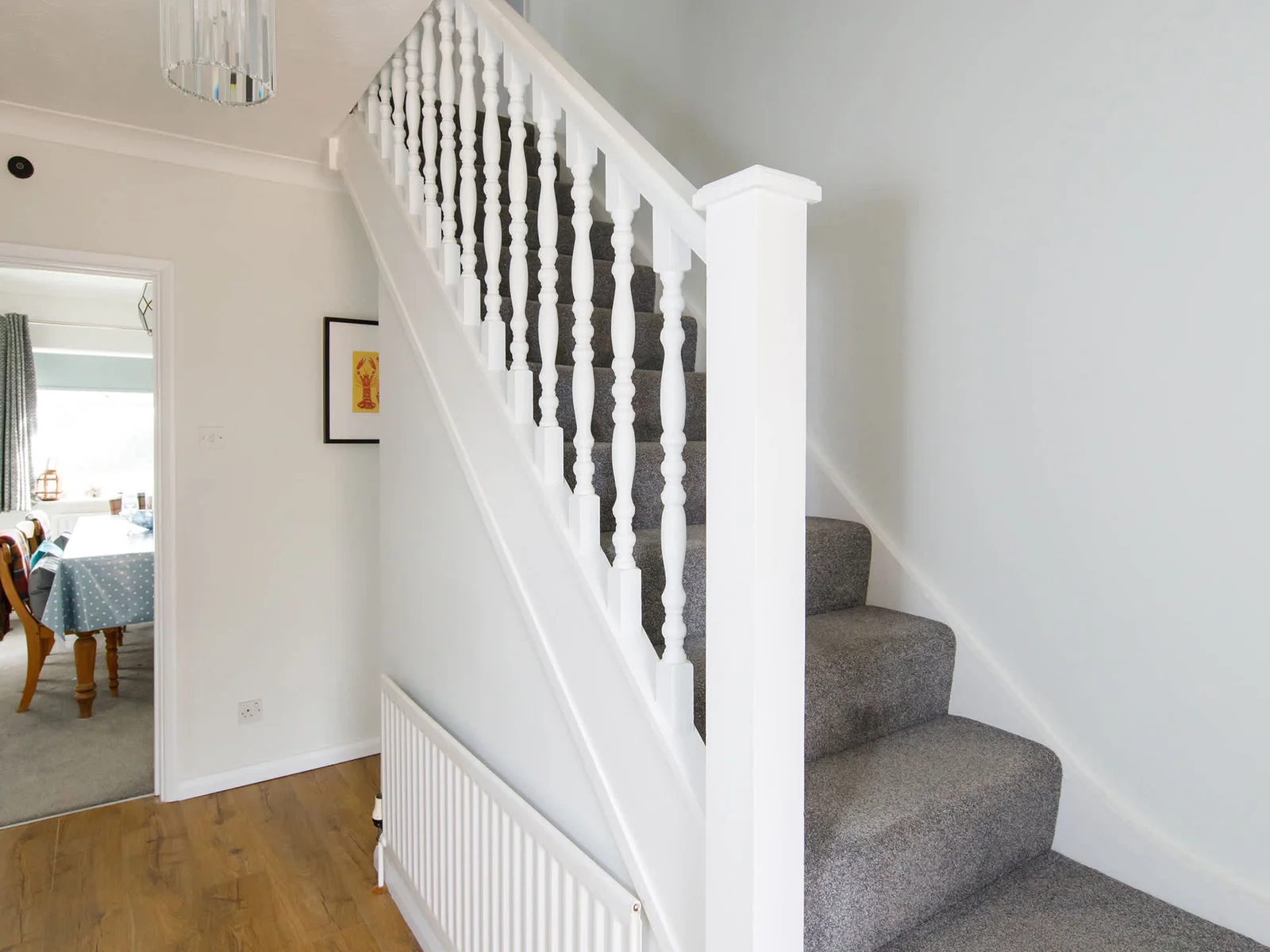The home spreads across two floors, with two bedrooms downstairs and two upstairs.