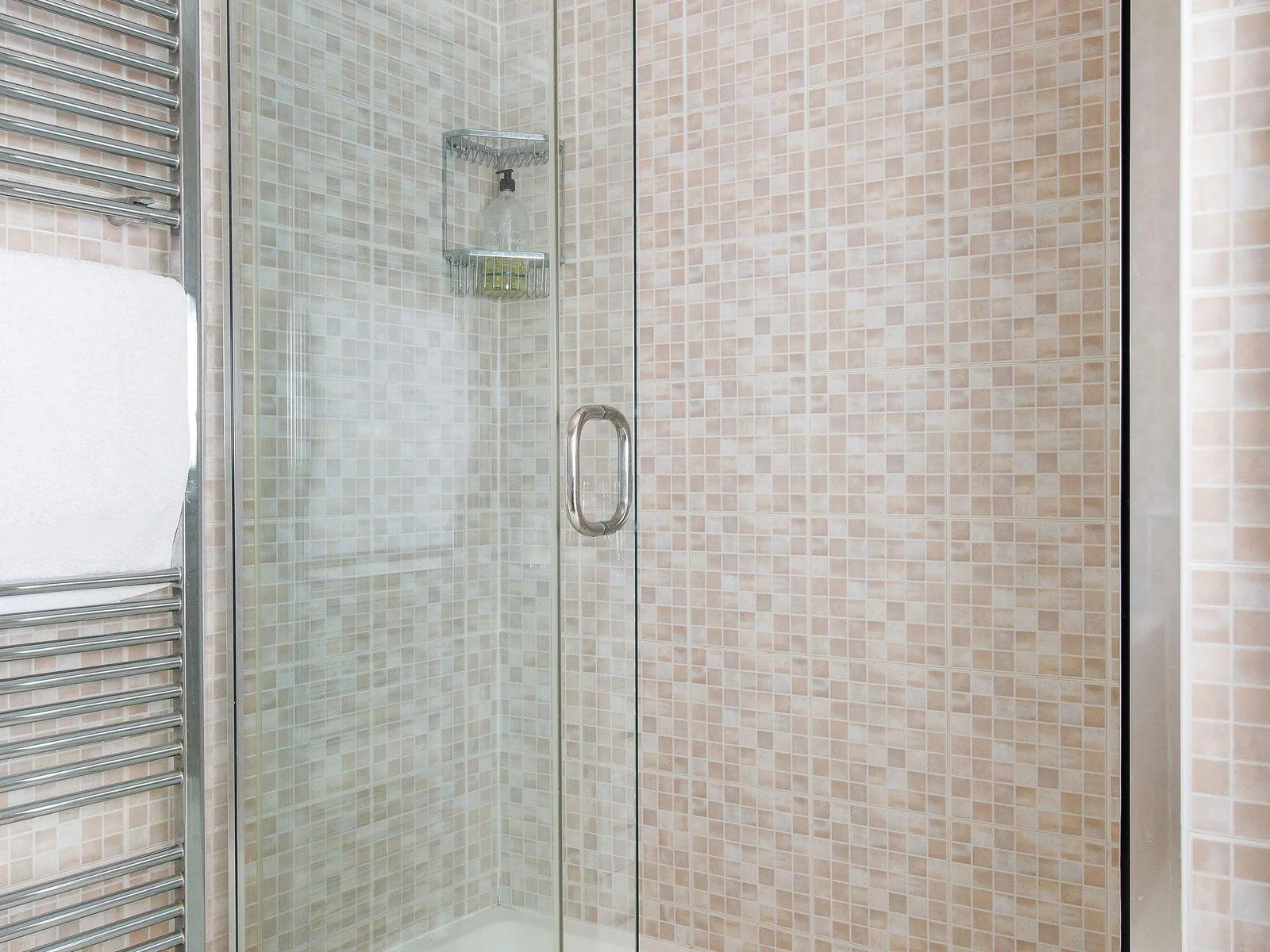 The family bathroom has a large separate shower.