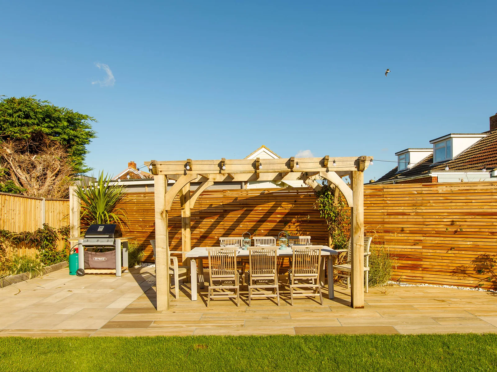 The home has a fantastic outdoor space, with an impressive dining area.