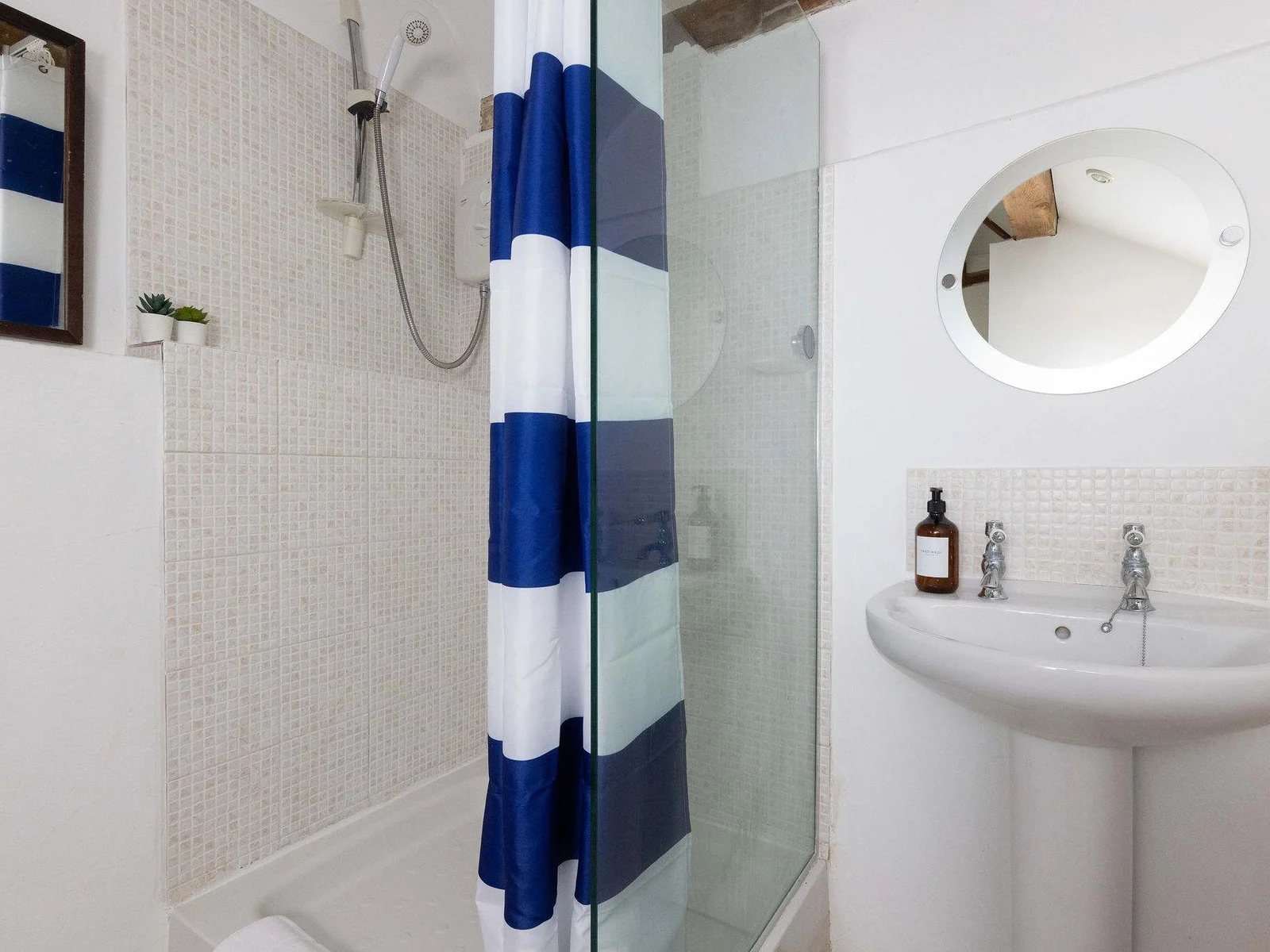 The shower ensuite to Wren Barn's master bedroom is spacious and bright.