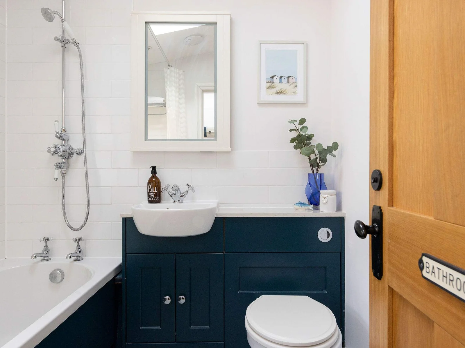 This charming cottage features a well-appointed family bathroom with a bath and shower.