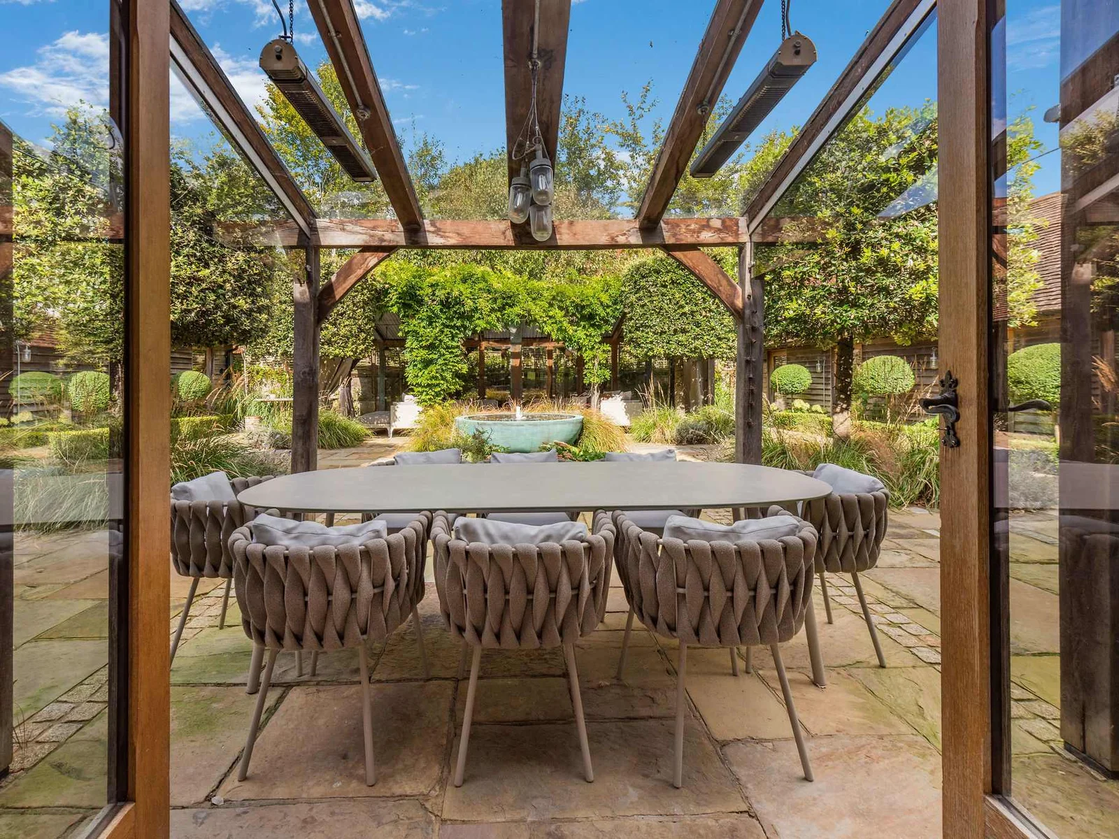 Covered courtyard dining with heaters for relaxed evenings outdoors