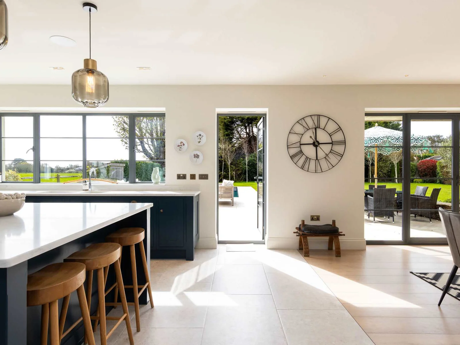 Seamless indoor-outdoor flow from the spacious kitchen to the sun-drenched landscaped garden beyond.