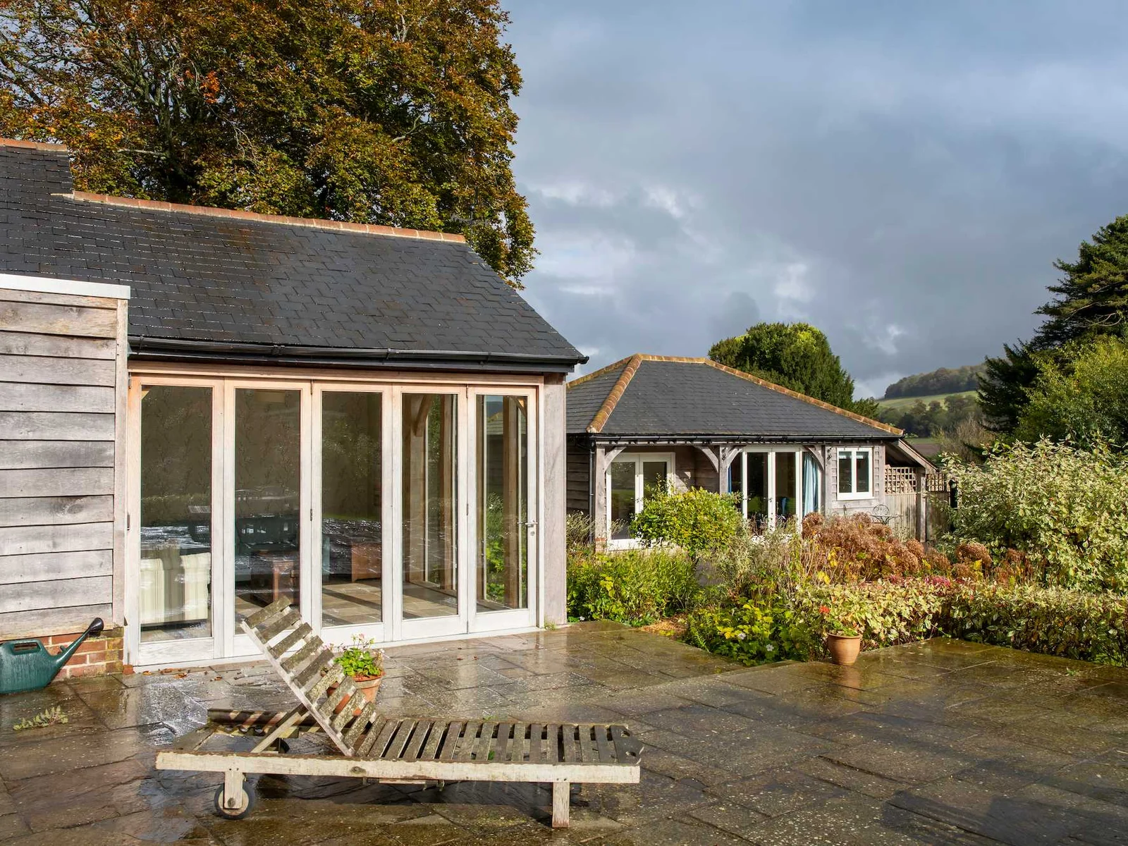 View showing the corner of the kitchen with patio doors then onto the annexe.