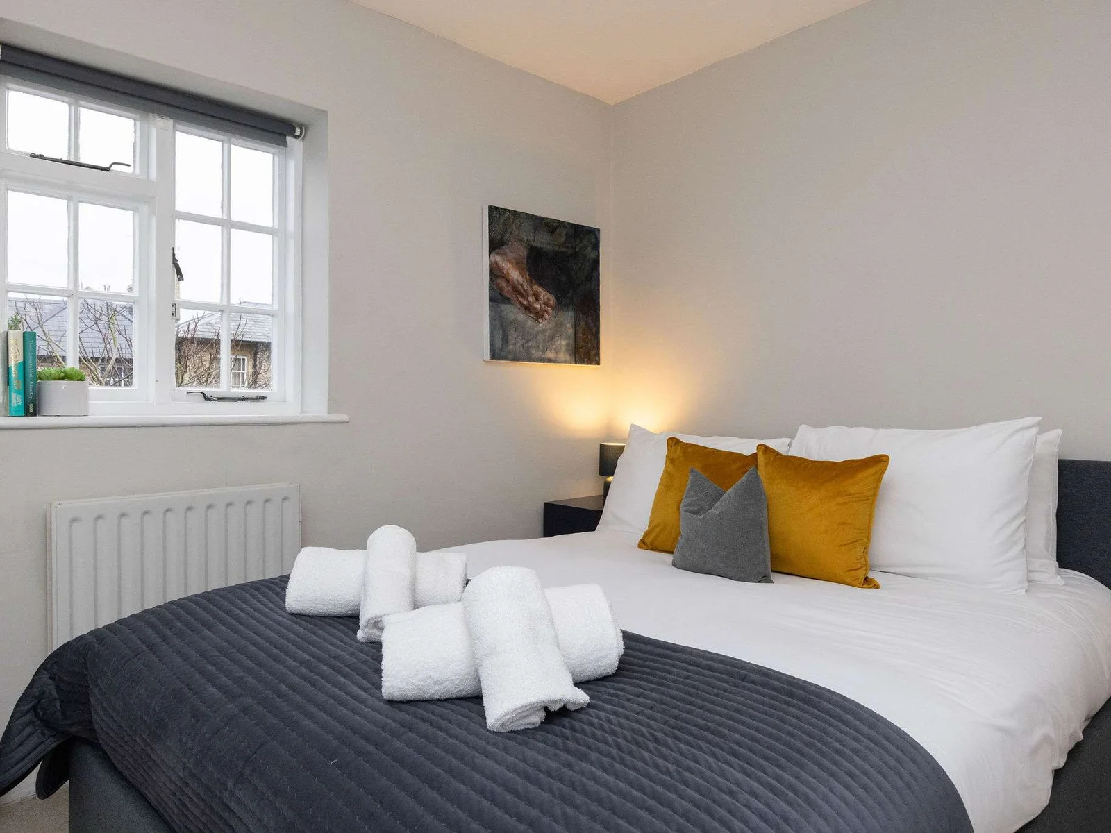 A beautifully designed small king bedroom offering comfort and style.