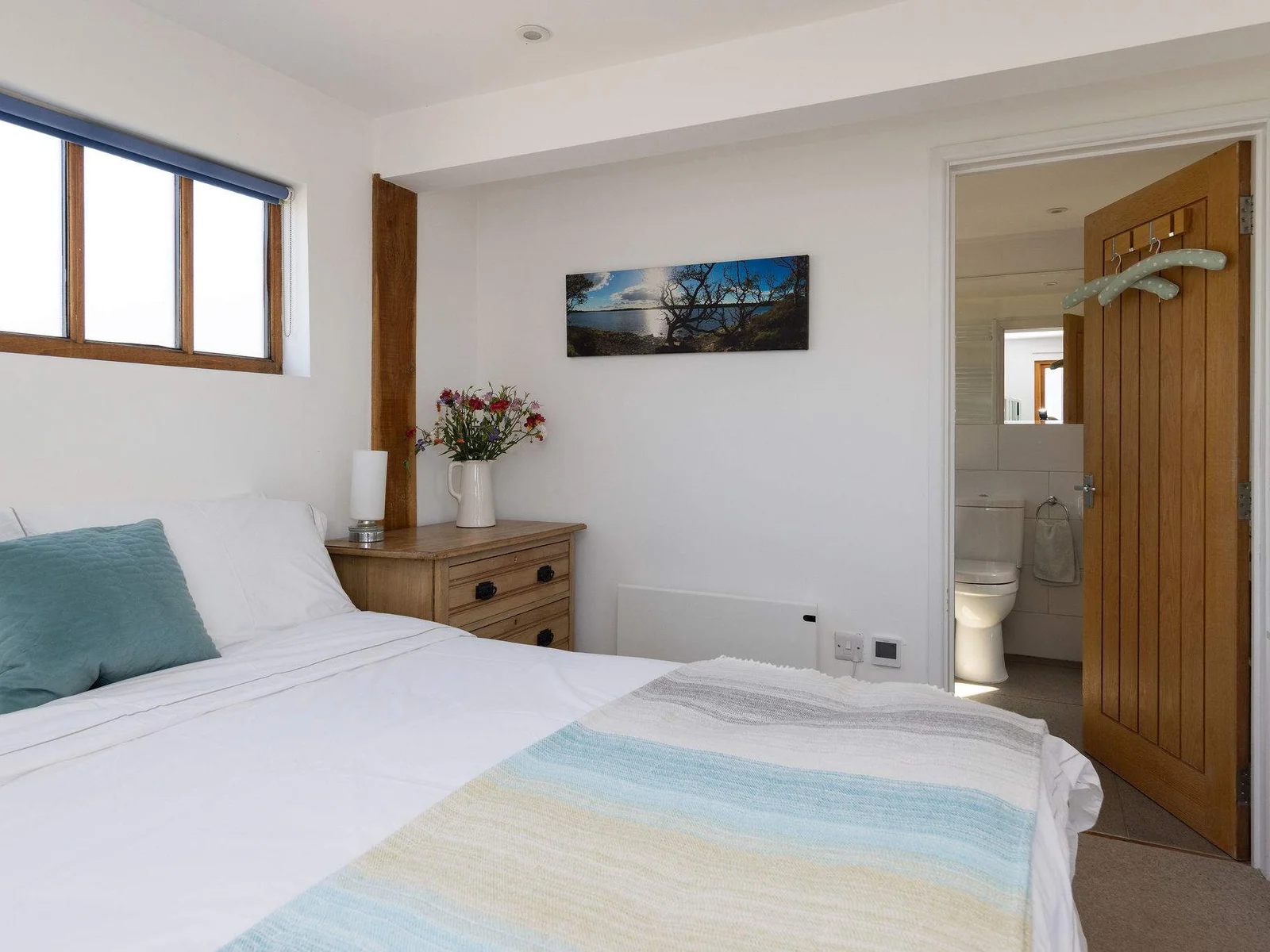Spacious master bedroom with a convenient en-suite bathroom.