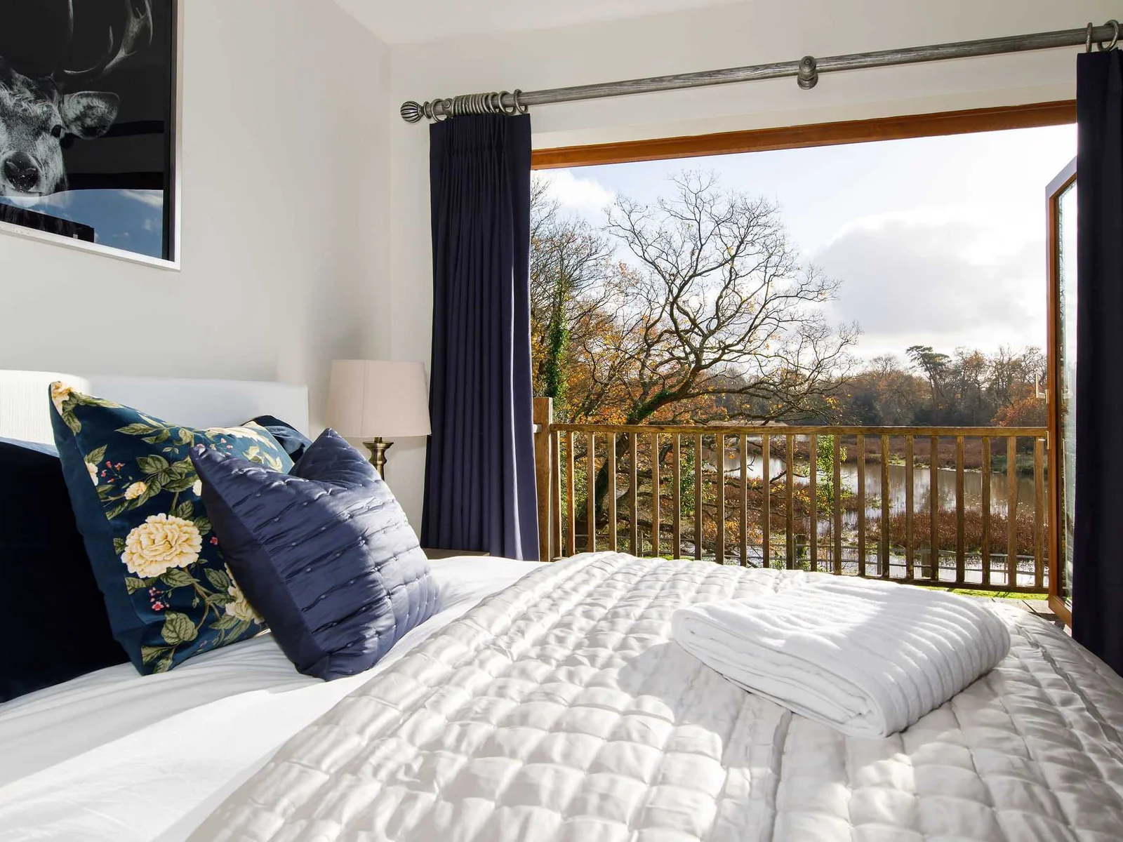 The master bedroom has balcony views to surrounding countryside and the river.