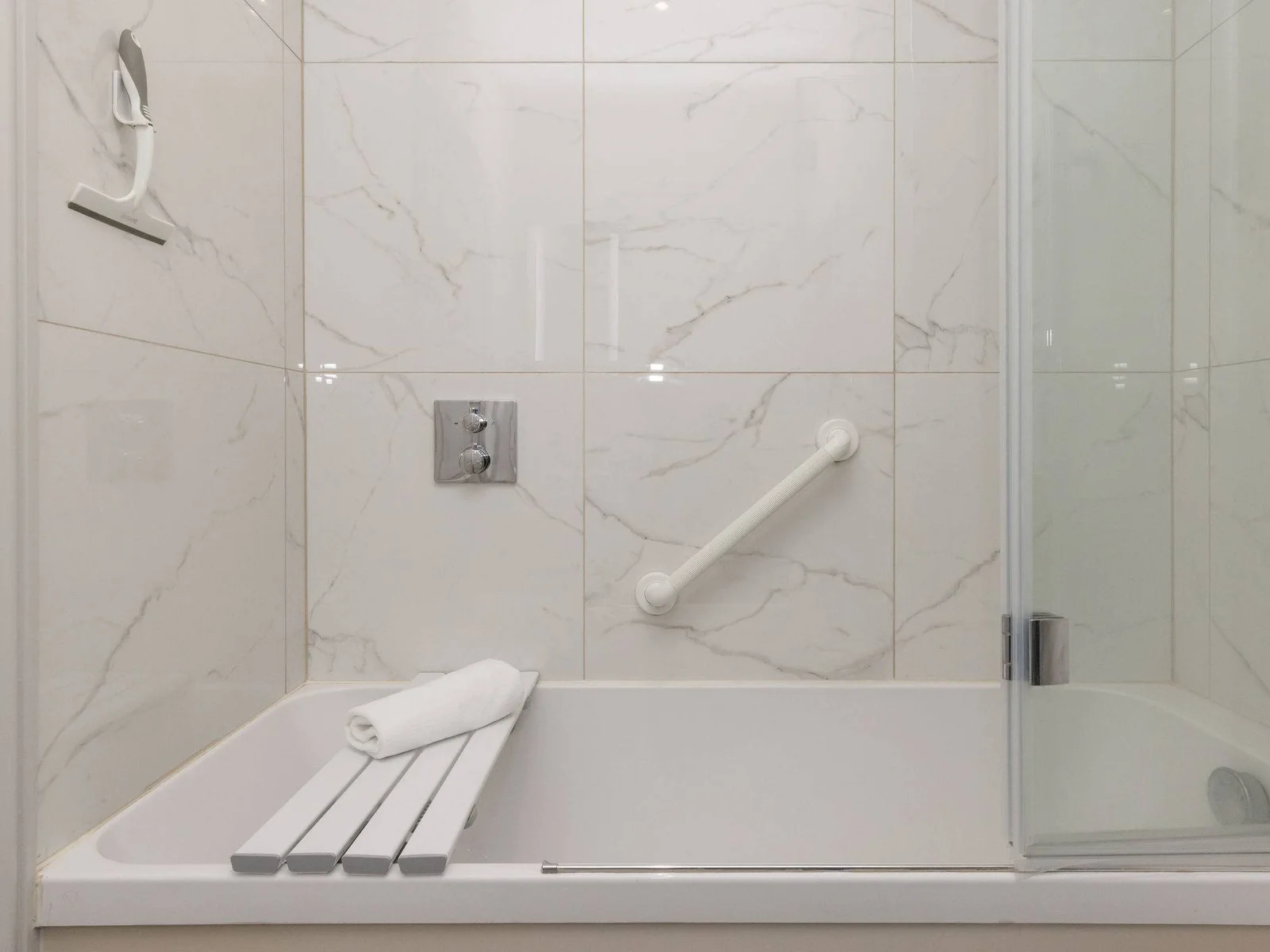 Fresh, modern bathrooms add comfort and ease to this relaxing stay by the sea.