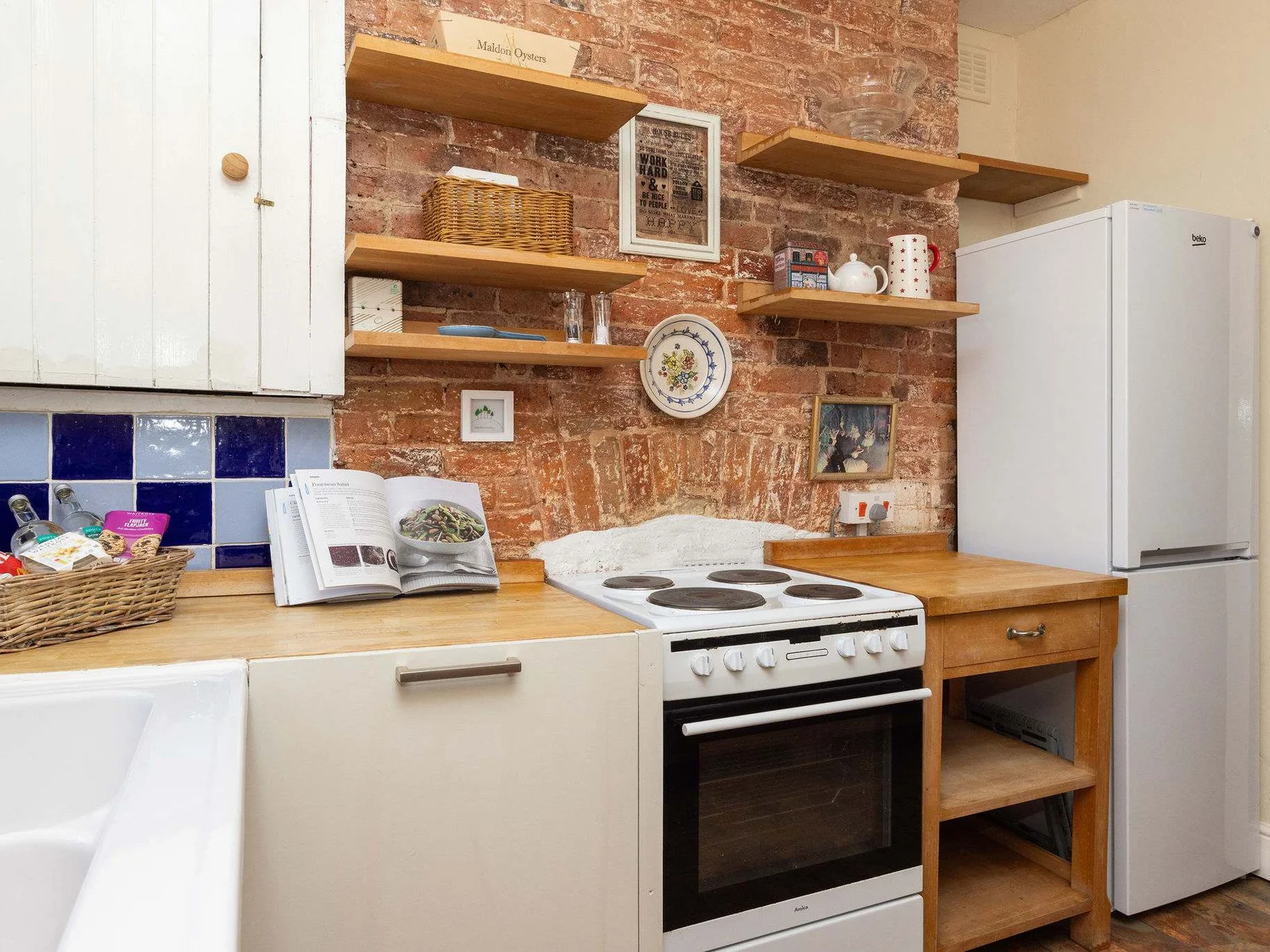 Fully-equipped kitchen with an oven and fridge, ready for your home-cooked meals.