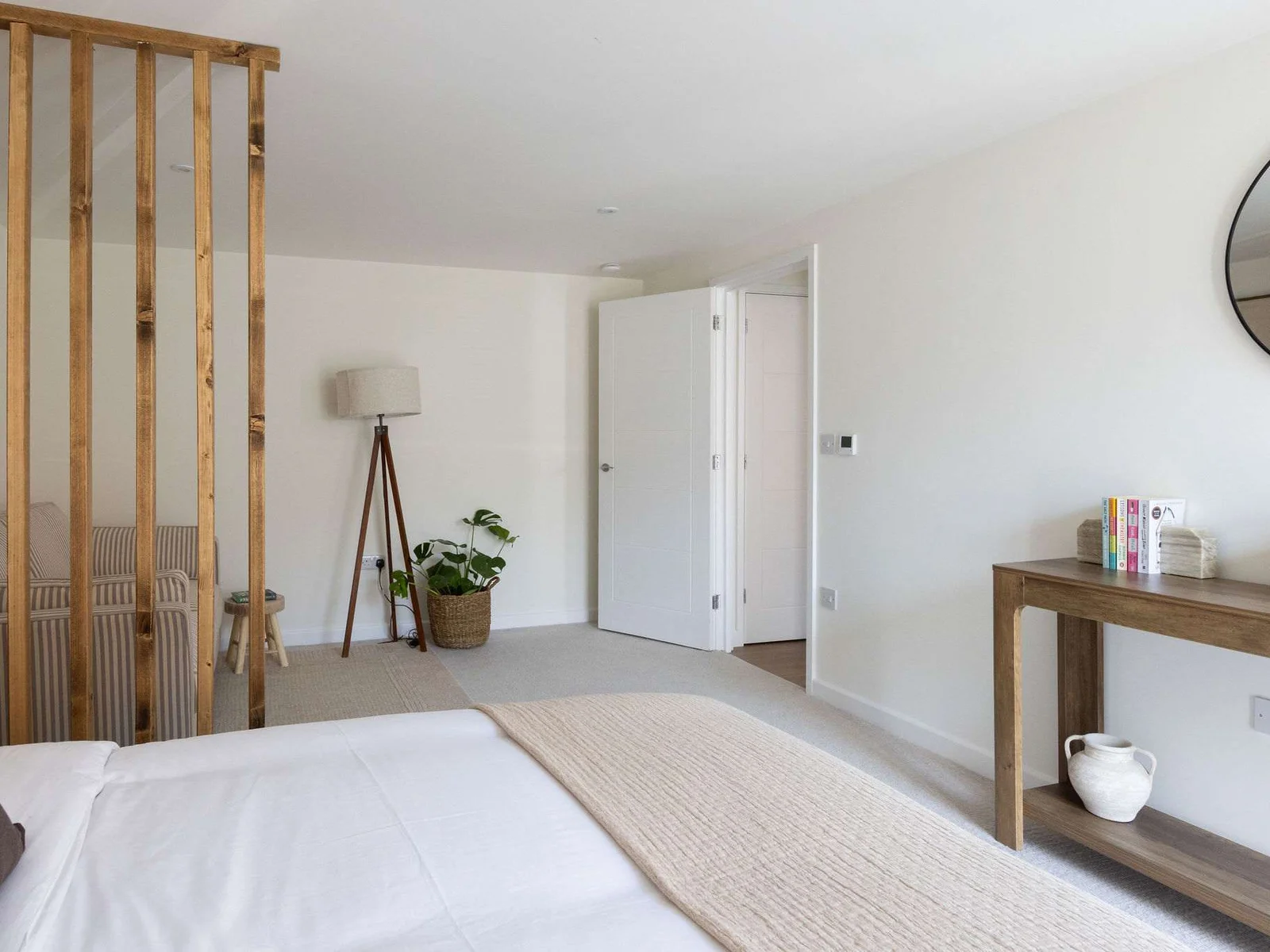 Spacious king bedroom with stylish furnishings, creating a relaxing retreat for your Chichester getaway.