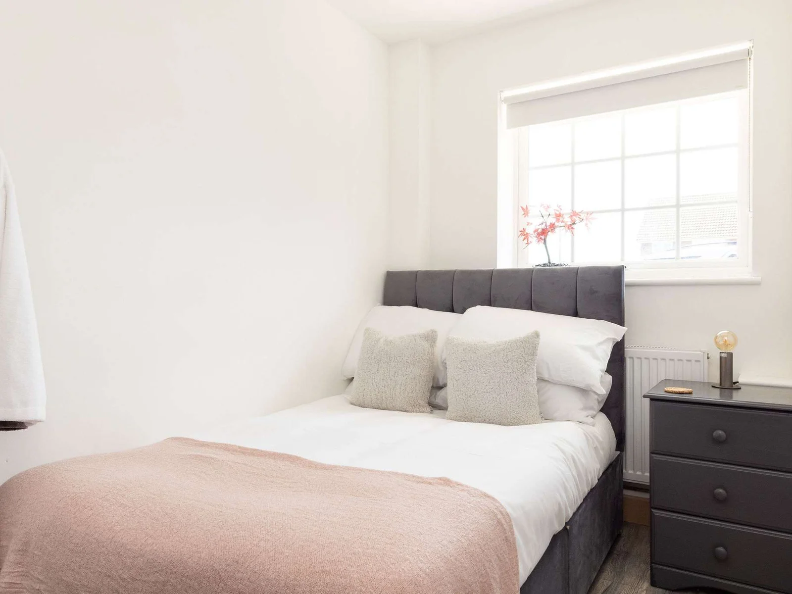 Cosy double bedroom with soft lighting