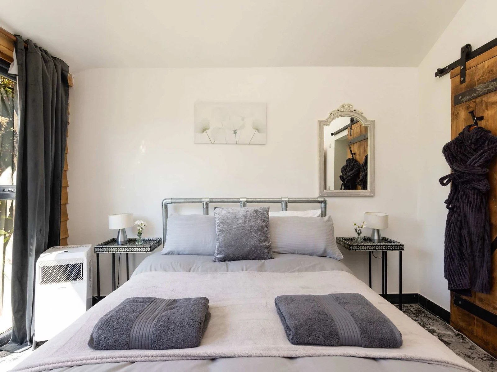 Unwind in this stylish, tranquil double bedroom with modern rustic touches.