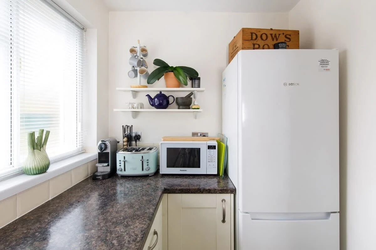You'll find a Nespresso machine, toaster, kettle, microwave and large fridge freezer.