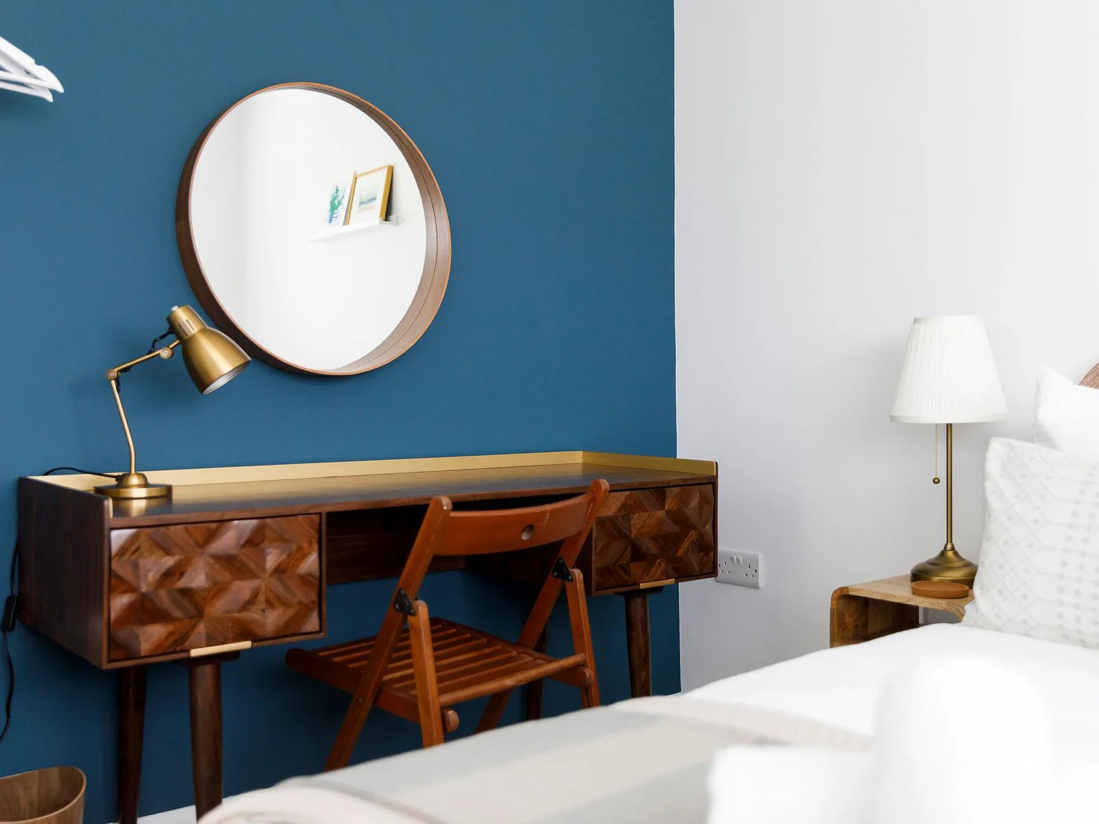 Bedside tables and lamps are in every bedroom.