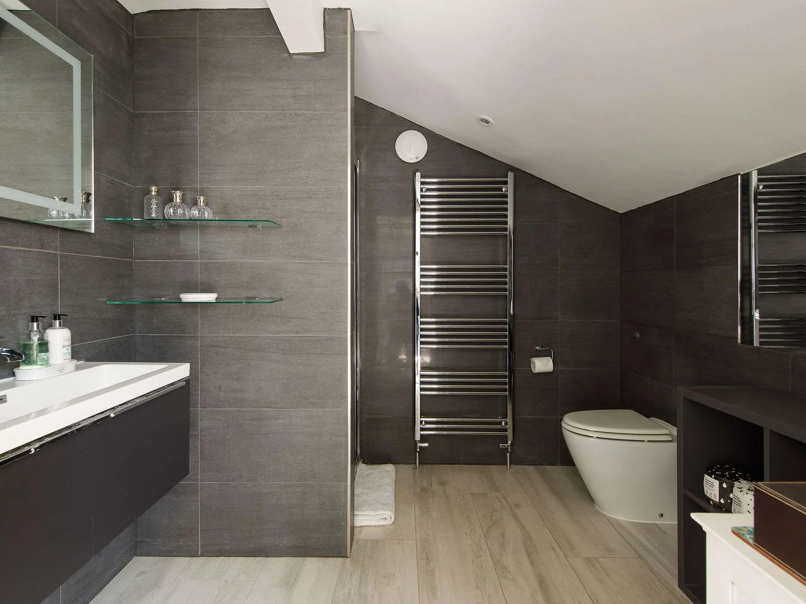 The ensuite has a huge walk-in shower, WC and sink.