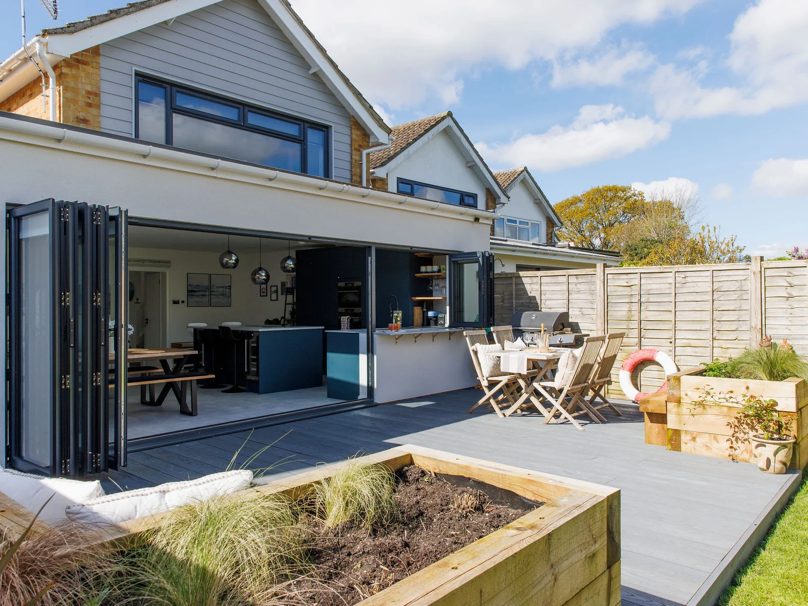 Step outside to the beautiful back garden with expansive decking, perfect for socialising & BBQs with loved ones.