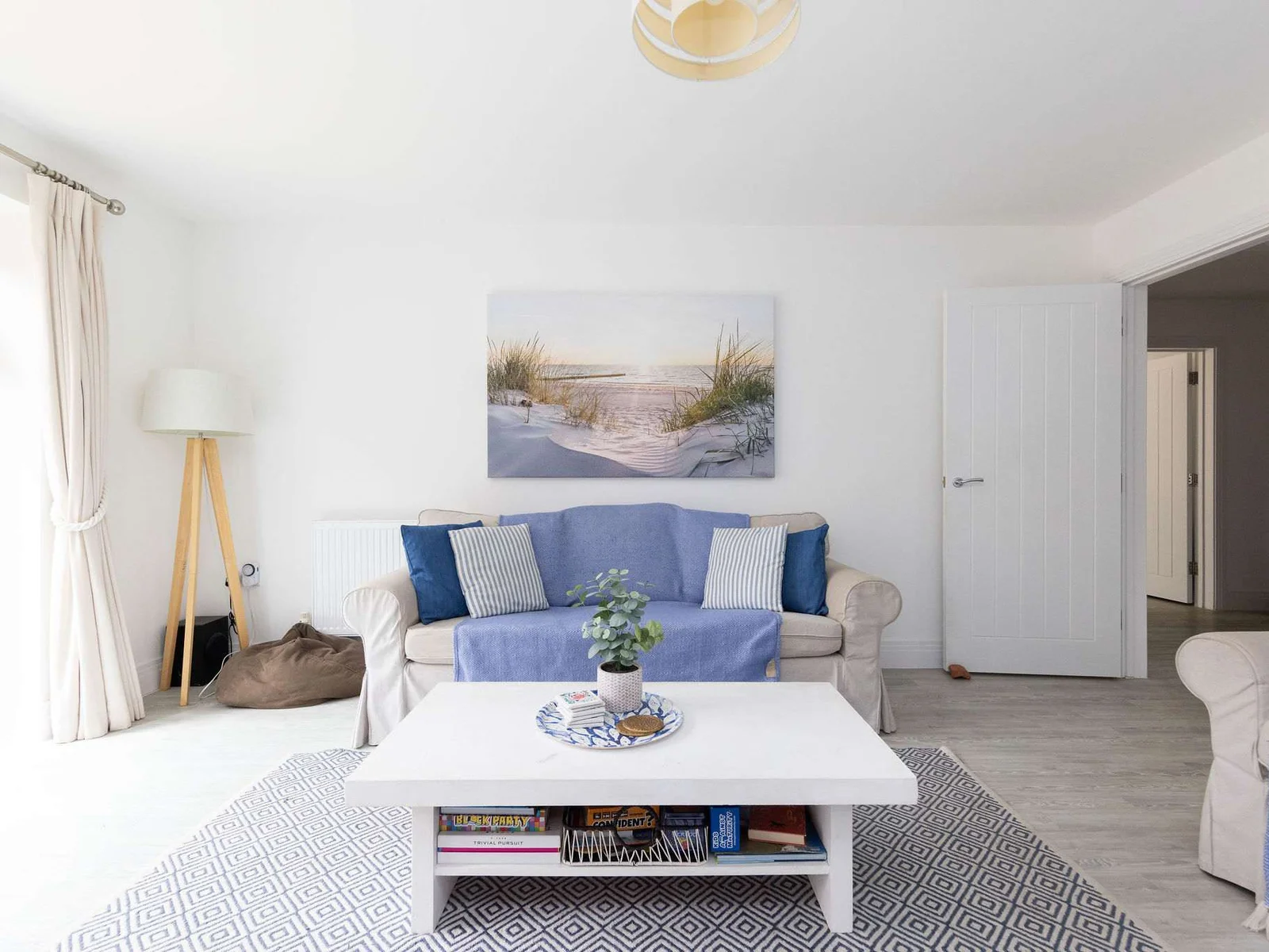 The stylish living area, designed for family comfort. With a Smart TV and a collection of board games, it's the perfect space to unwind together in the evenings.
