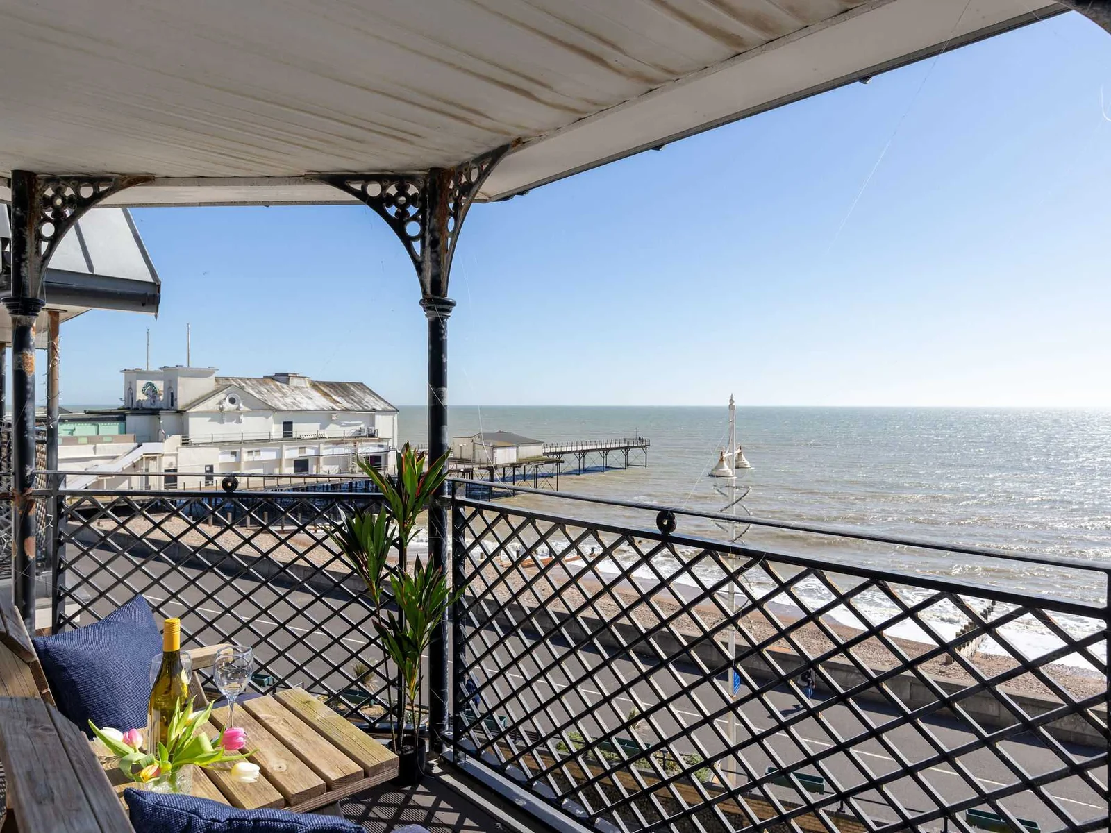 Sweeping coastal views make this stylish apartment a standout choice for a seaside escape.