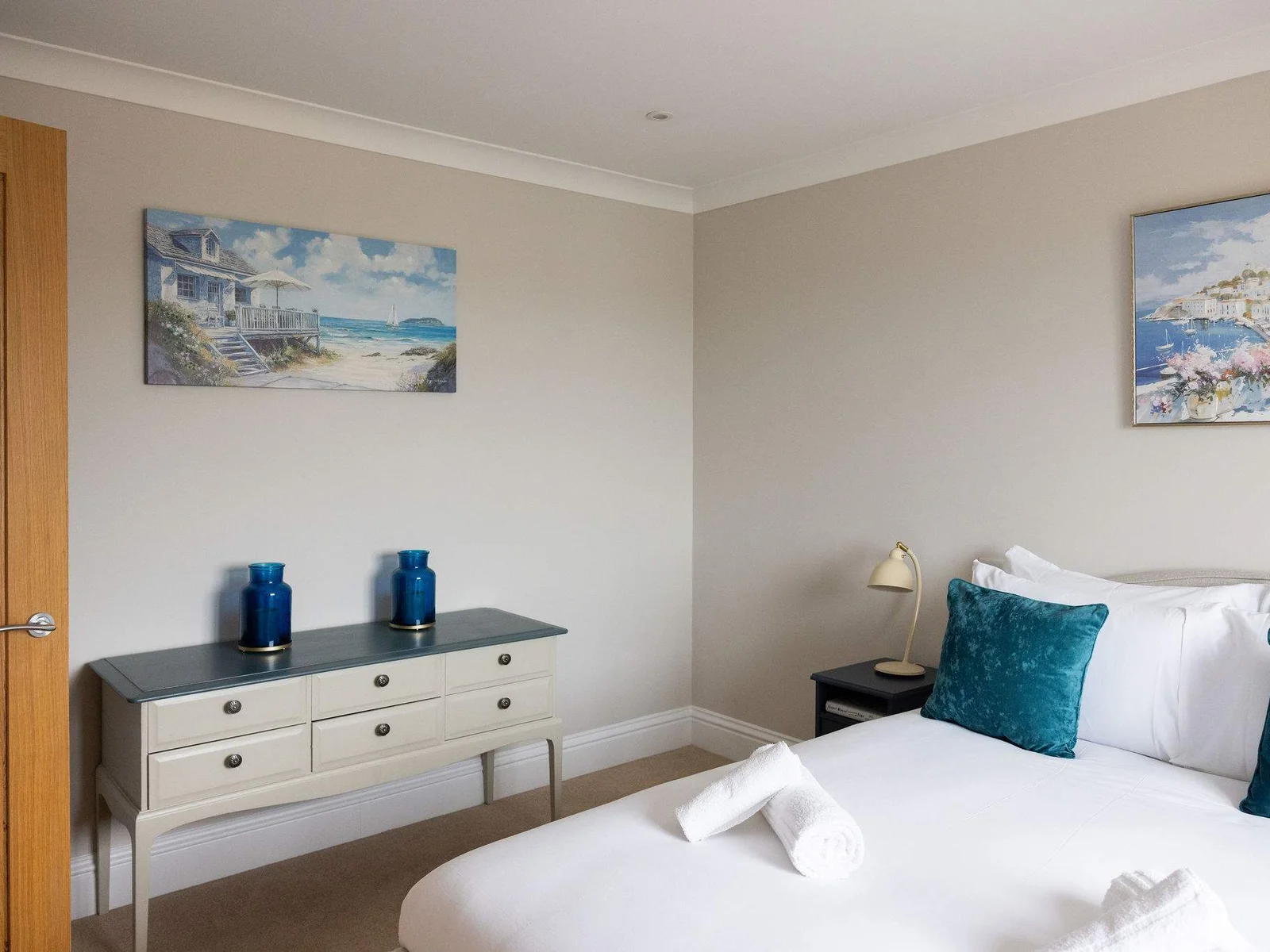 Soft coastal artwork and thoughtful touches add character!