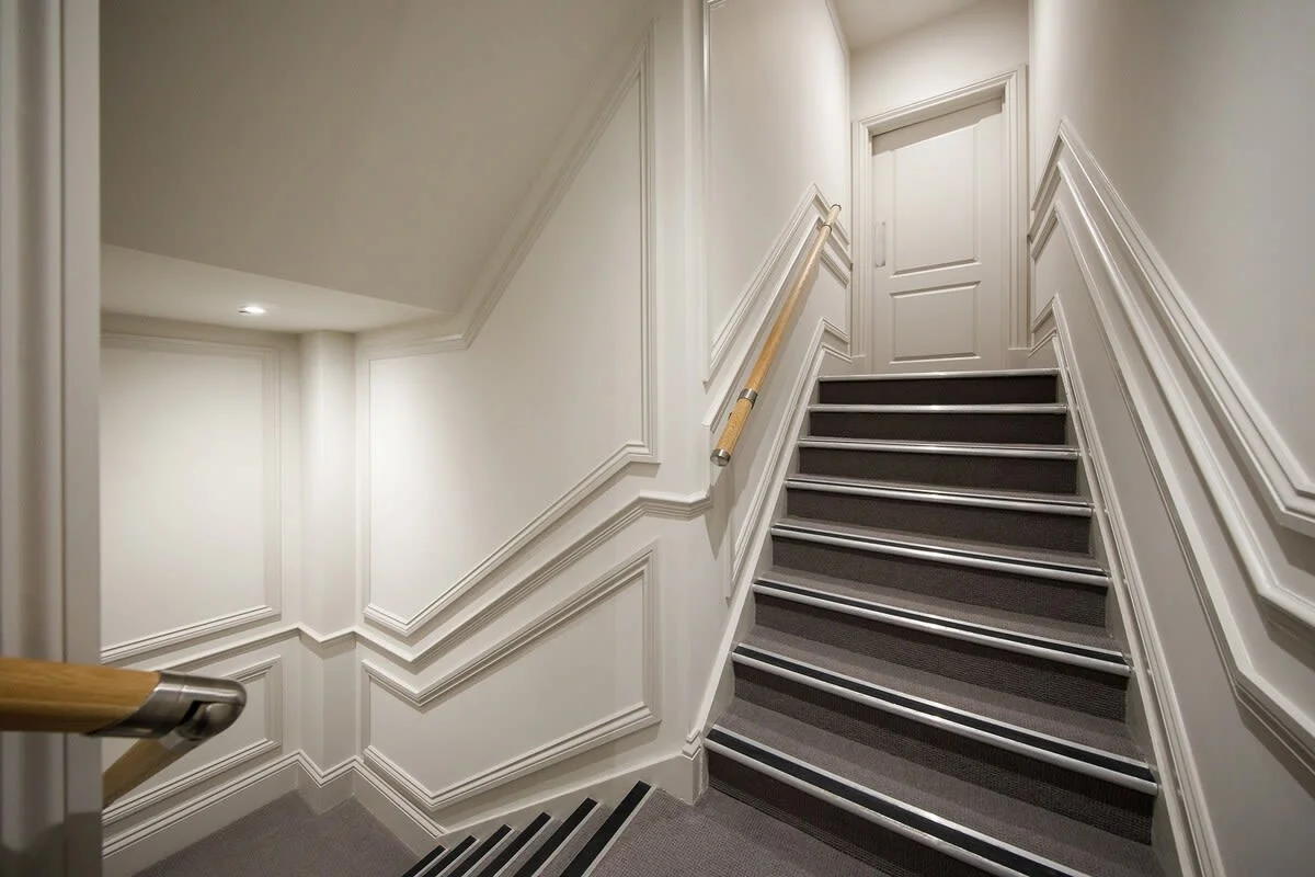 The apartment is accessed via a staircase