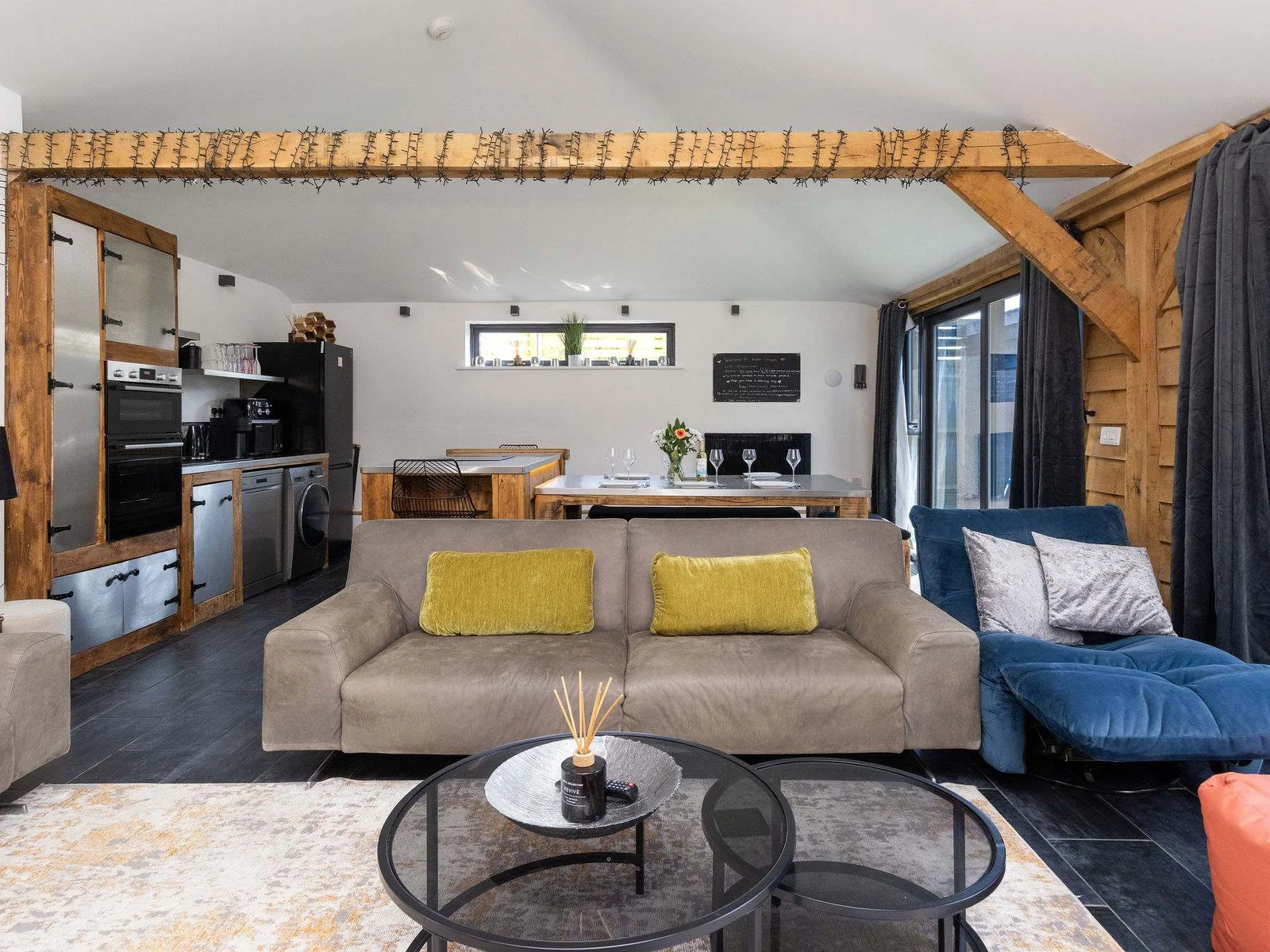 Unwind in a beautifully designed open-plan living area perfect for relaxing and cozy evenings in.