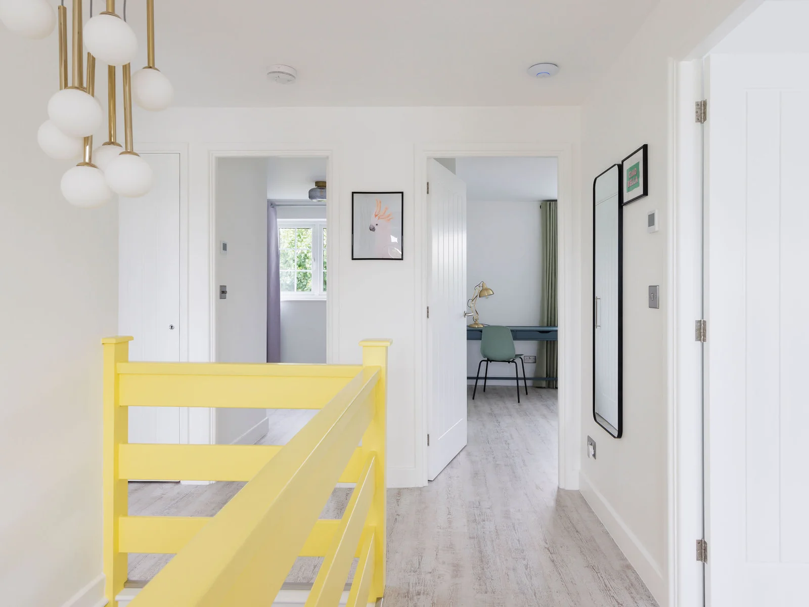 Bright hallway leading to the master bedroom with modern decor