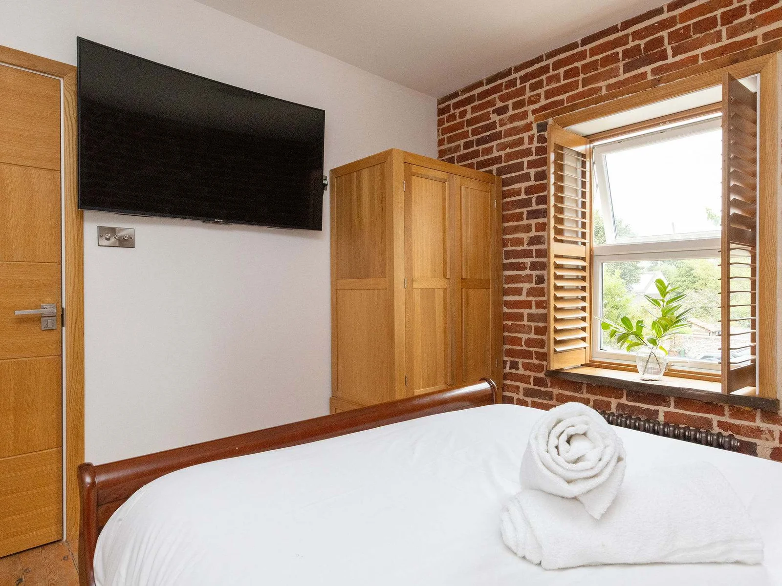 Bedroom 2- Another king size bedroom, featuring a wall mounted tv.