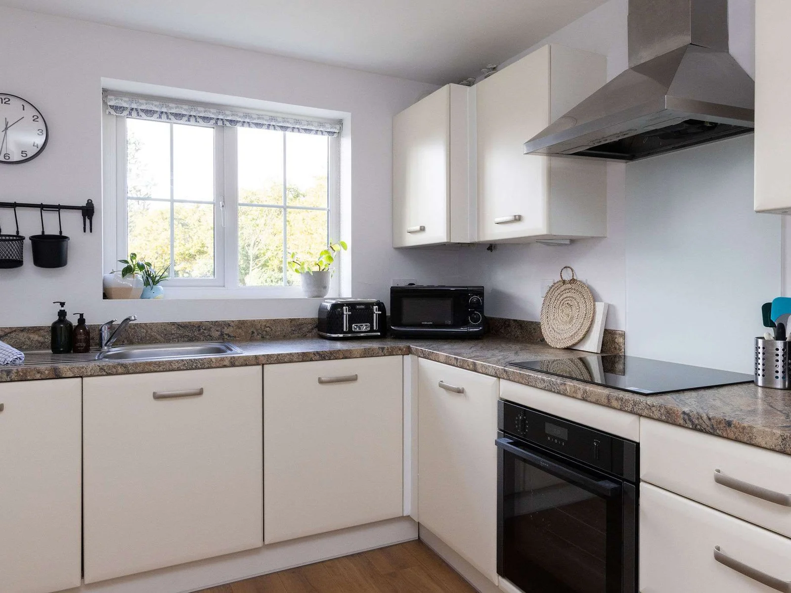 The bright kitchen has everything you need to cook meals and prepare picnics.