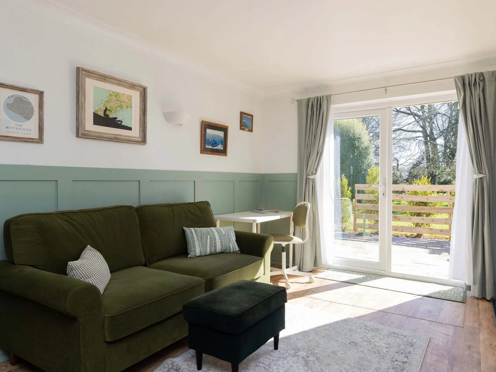 French doors open to a bright, relaxing lounge with private patio access for easy indoor-outdoor living.