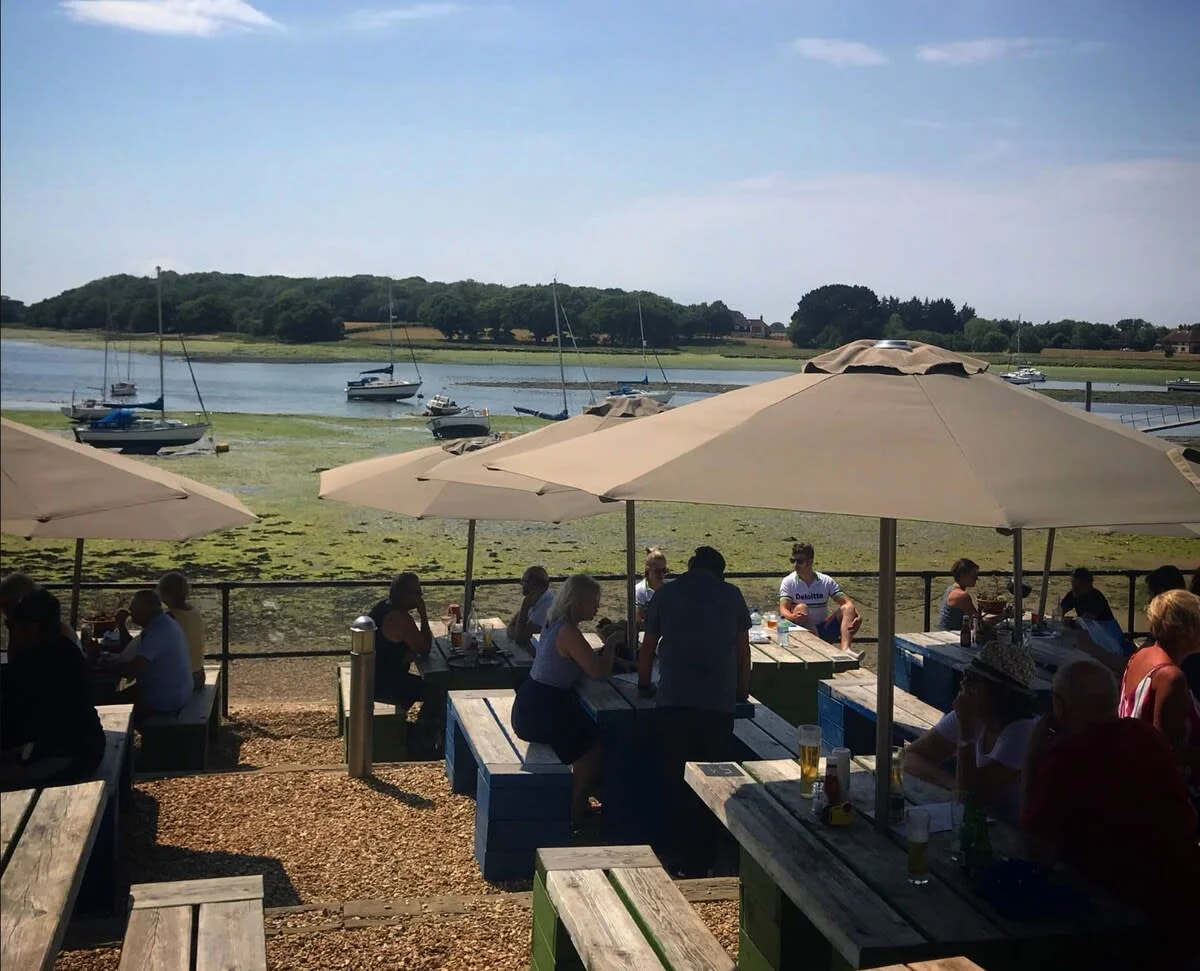 Explore the coastal culinary delights at waterside pubs and restaurants, many that have a focus on fresh local produce (pictured, The Crown and Anchor, Dell Quay).