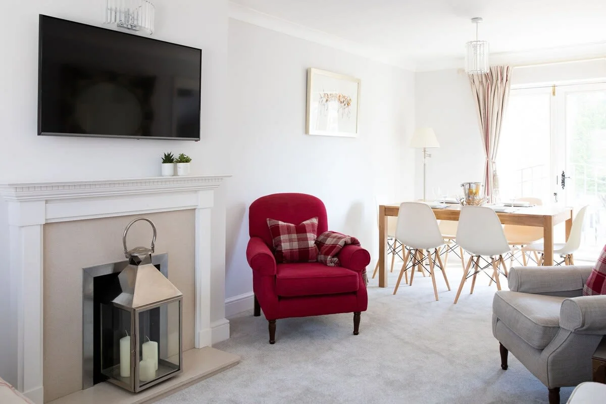 The first floor features an open plan living and dining space with a separate kitchen.