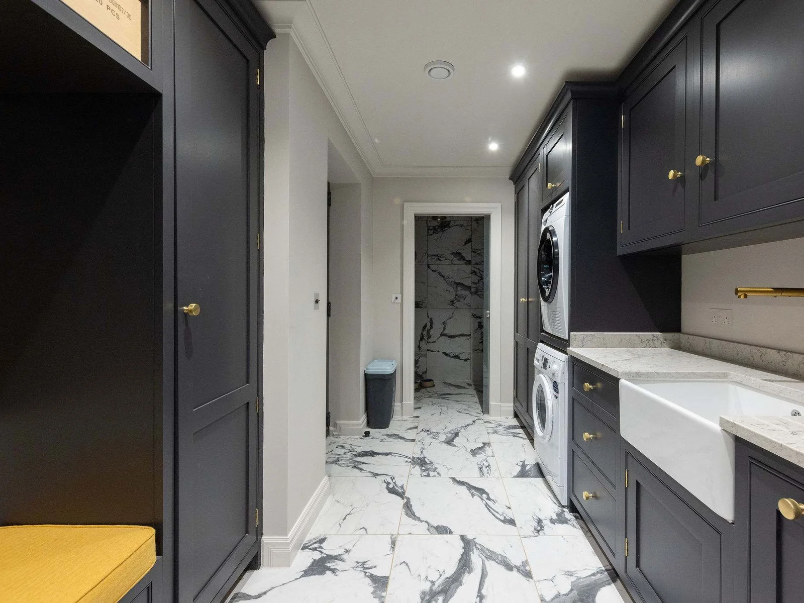 Well-equipped utility space with washer, dryer, and marble-effect flooring – ideal for extended stays