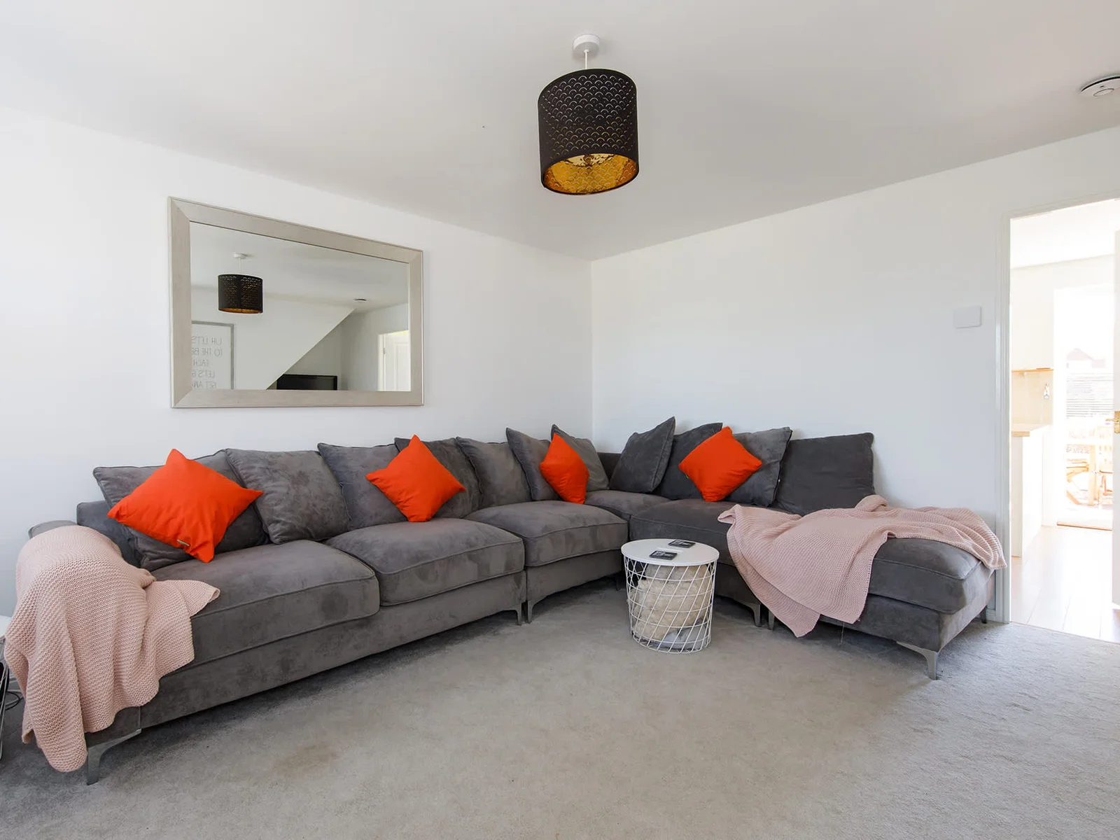Relax and unwind with the whole family on the huge corner sofa.