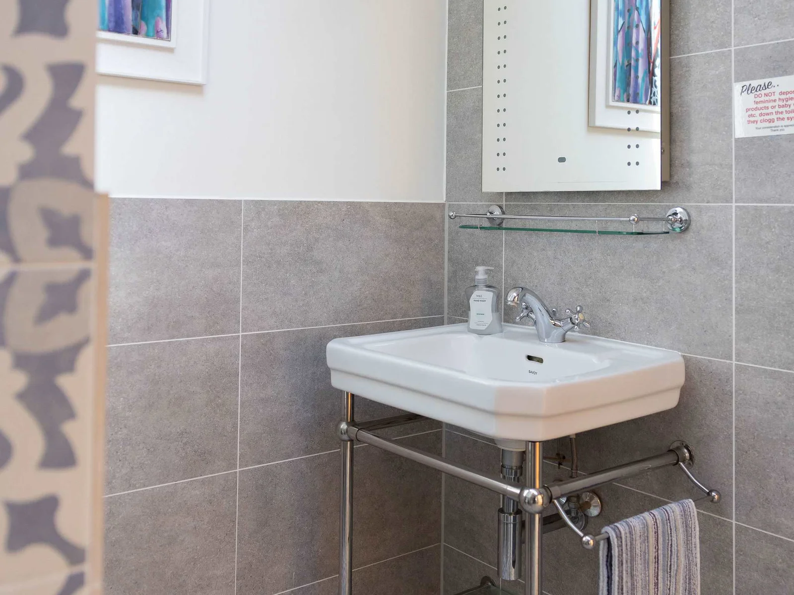 Experience this cozy and stylish bathroom