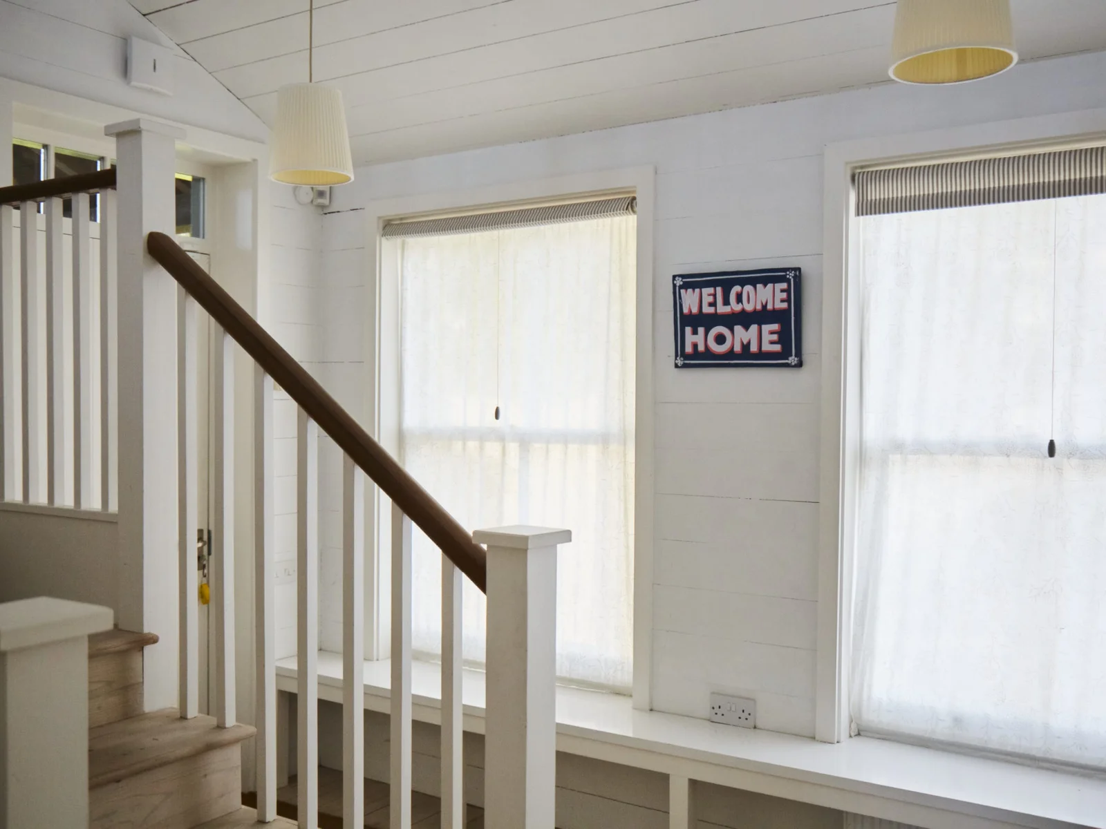 Welcoming entrance hall with stairs leading to the first floor, setting the tone for a great stay